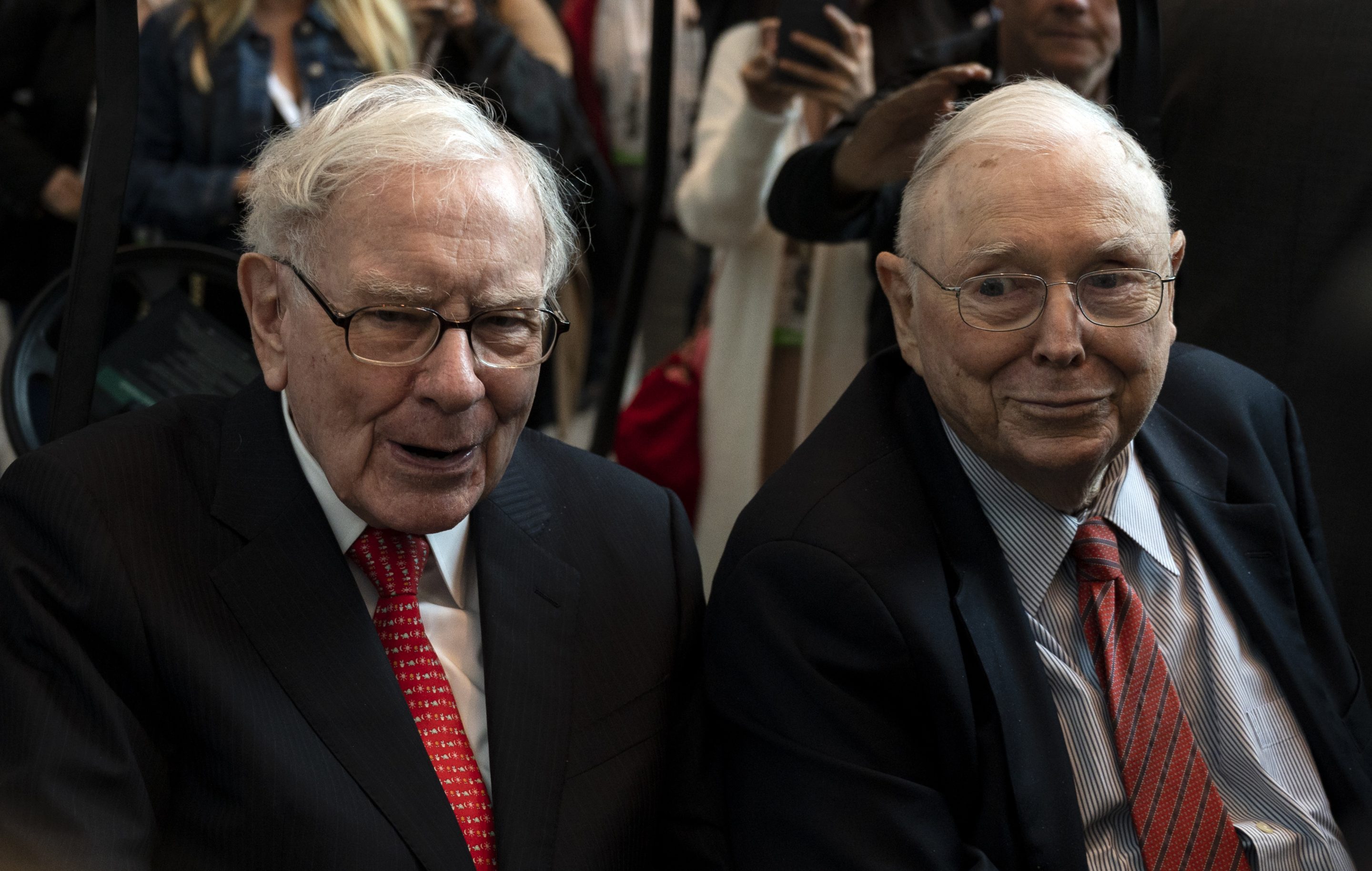 Berkshire Hathaway CEO Warren Buffett sits next to Vice Chairman Charlie Munger