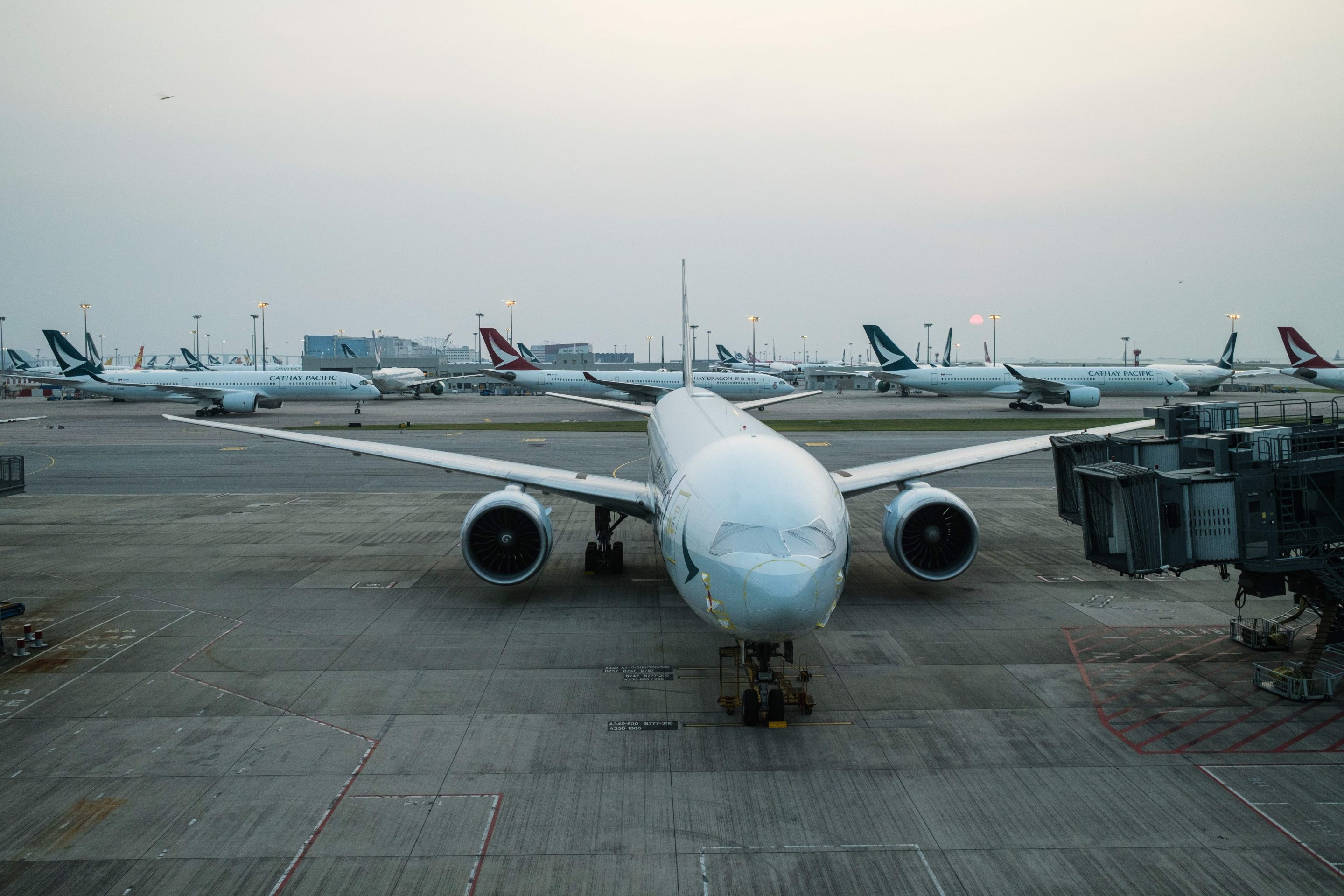 Cathay Pacific and Cathay Dragon passenger jets sit on the tarmac at Hong Kong International Airport in October 2020. 