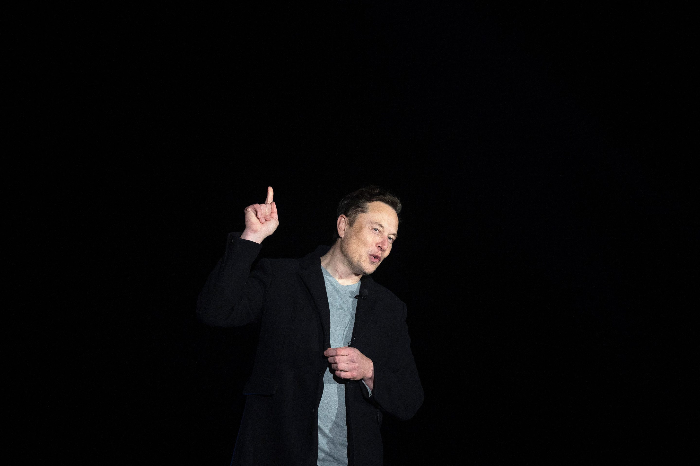 Elon Musk gestures as he speaks during a press conference at SpaceX's Starbase facility near Boca Chica Village in South Texas on Feb. 10, 2022.