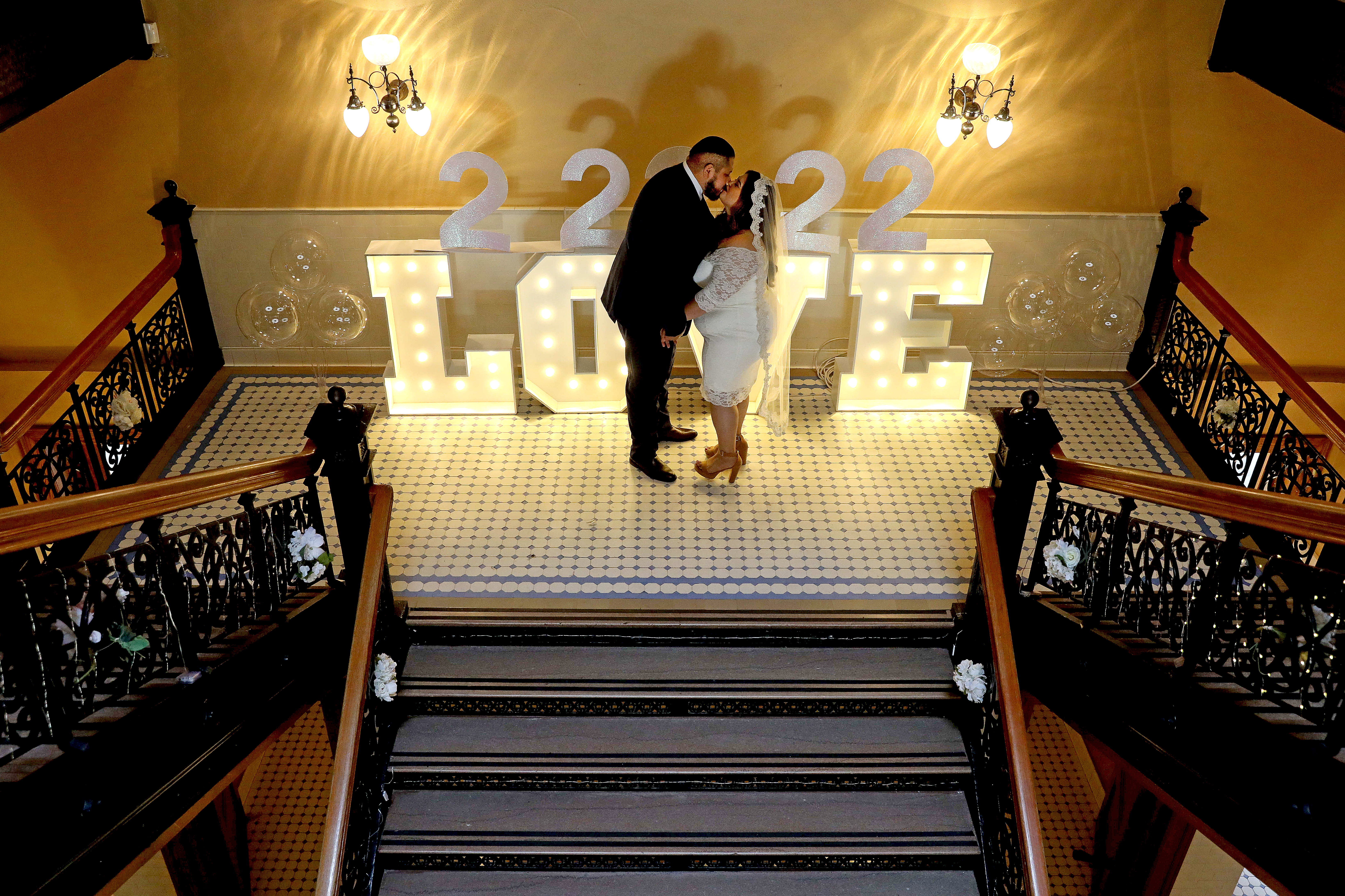 Carlos Lira, left, of Chino Hills, and Precious Rodriguez-Lira, tie the knot on Tuesday, Feb. 22, 2022 in Santa Ana, Calif.