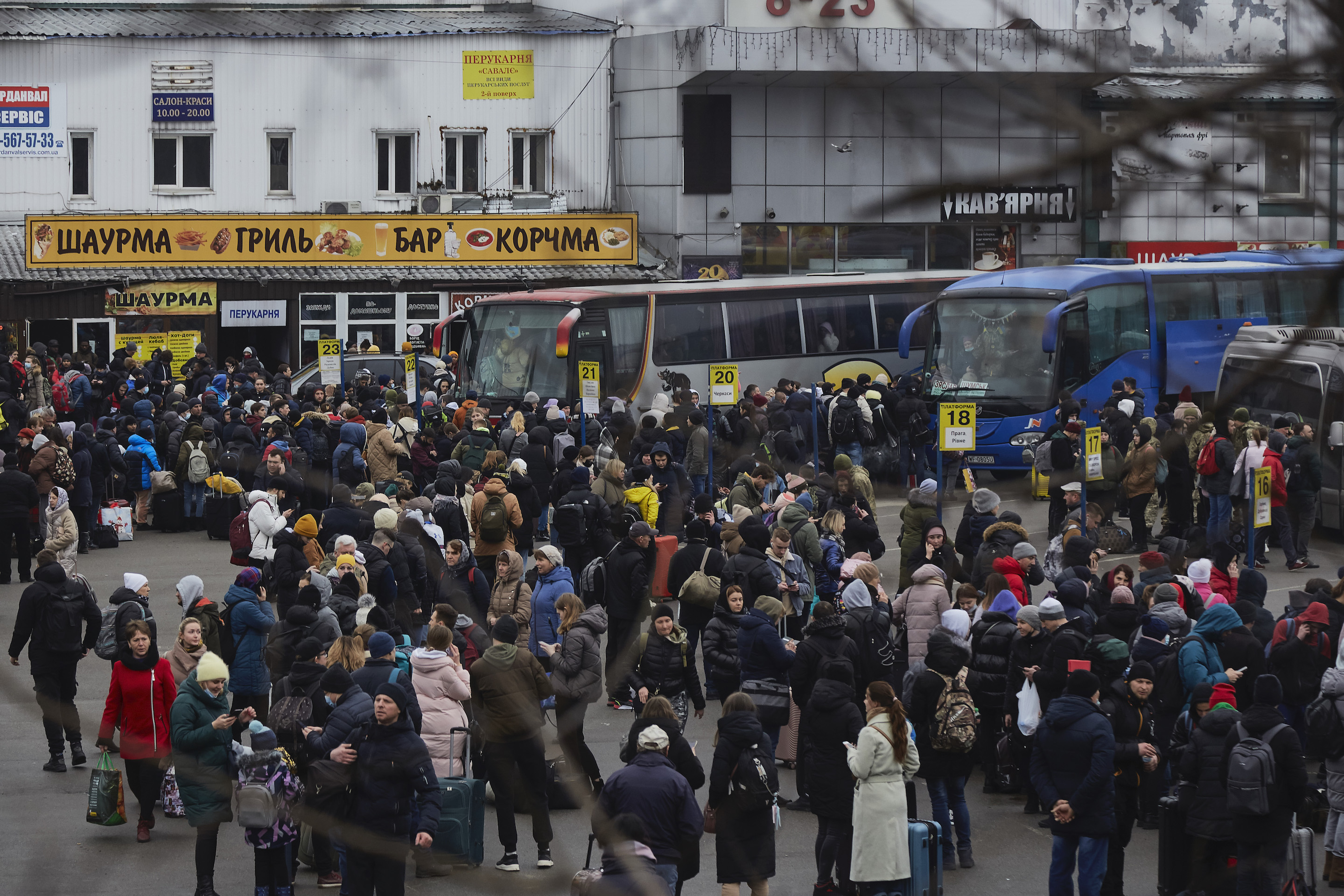 People waiting for a bus to evacuate Kyiv on Feb. 24, 2022.
