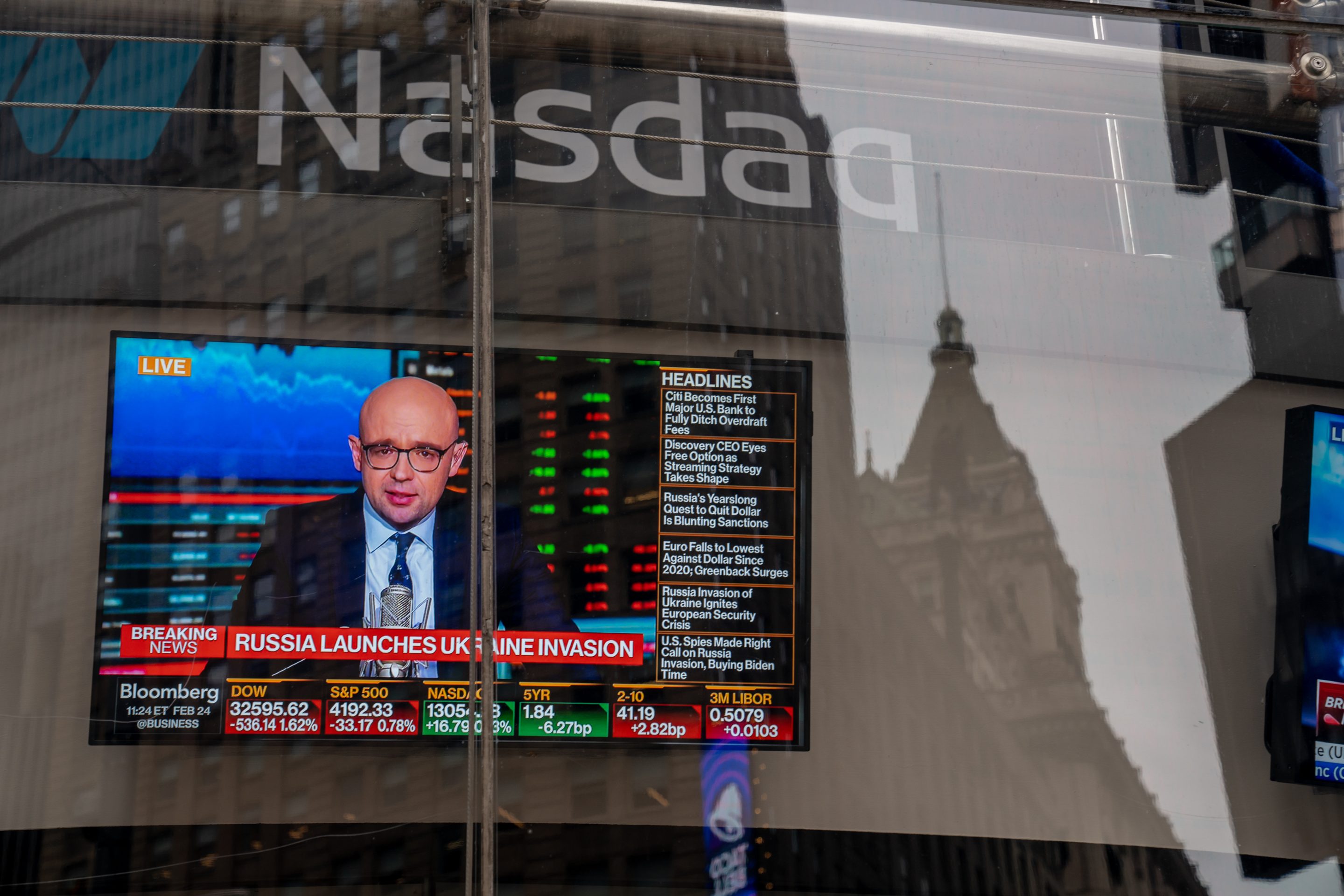 News about the Russian invasion of Ukraine on a television at the Nasdaq in New York, on Feb. 24, 2022.