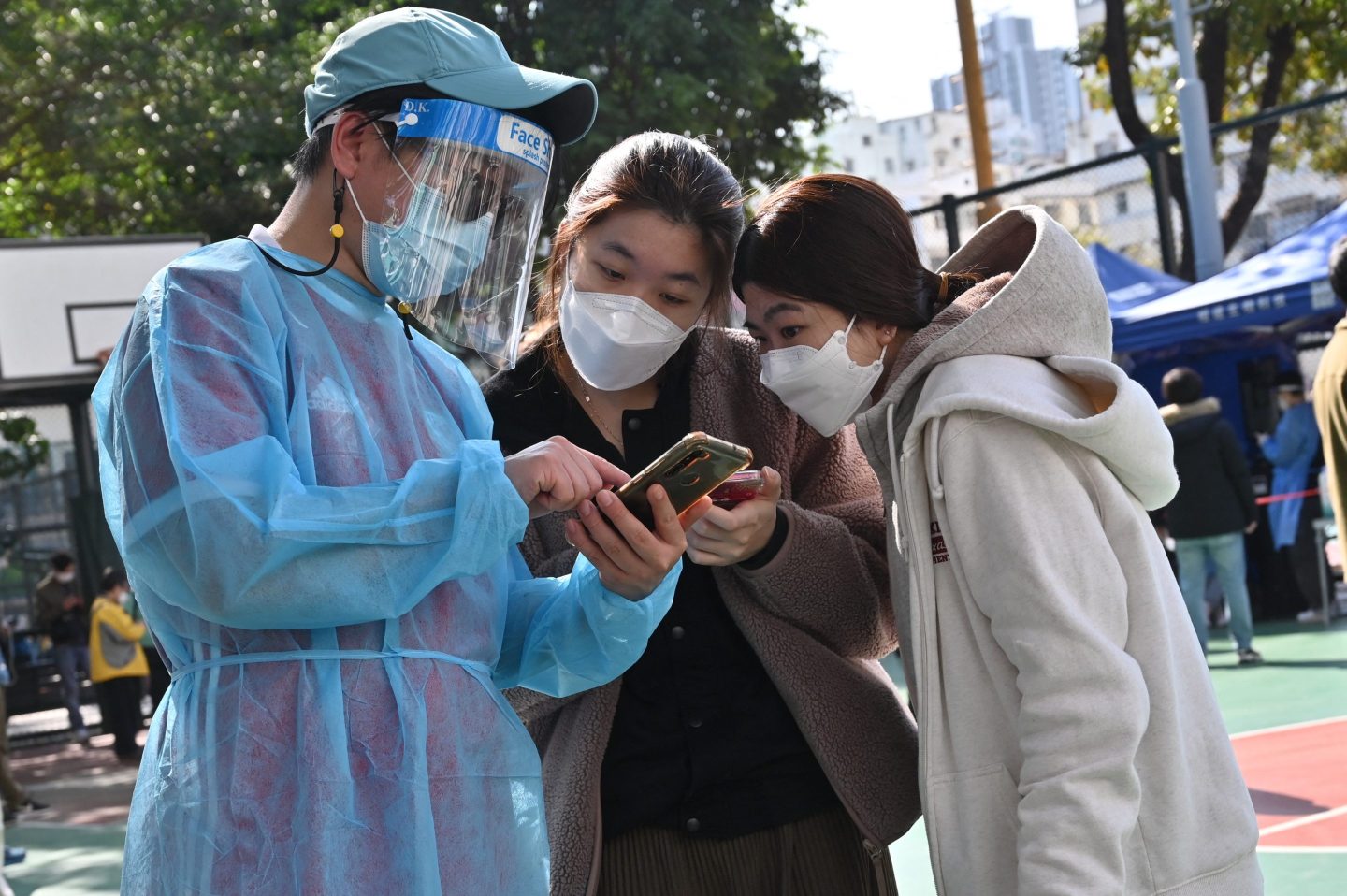 Record Omicron outbreak is forcing Hong Kong to abandon some pillars of Beijing’s COVID-zero strategy