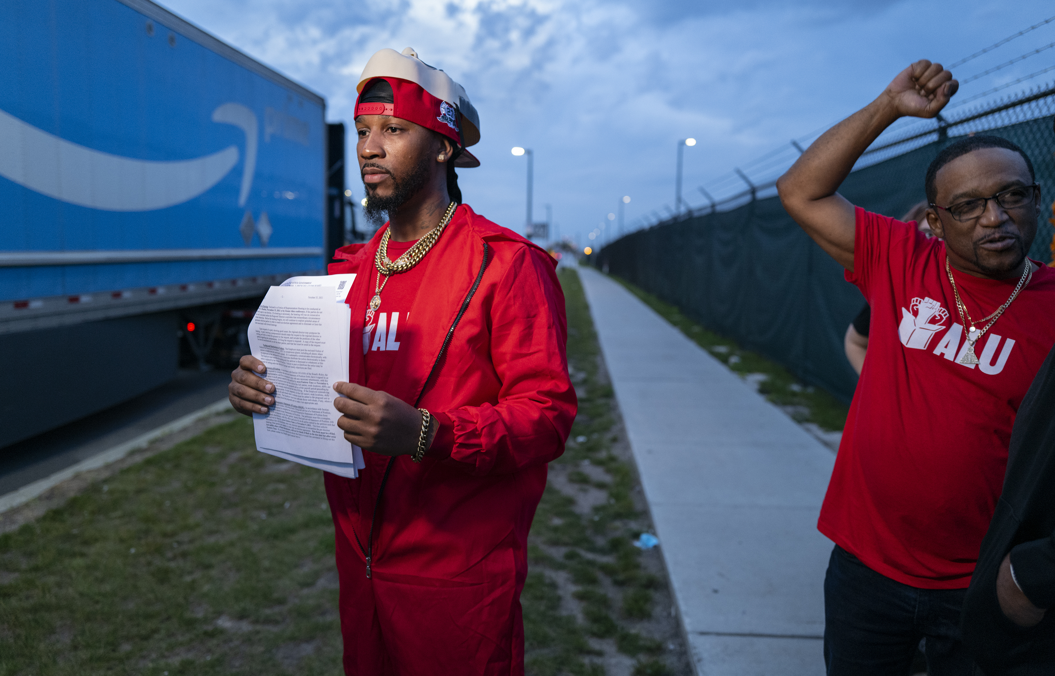 Chris Smalls, president of the Amazon Labor Union, joins supporters at the Amazon distribution center in the Staten Island borough of New York, Monday, Oct. 25, 2021, as he holds "Authorization of Representation" forms that were earlier delivered to the National Labor Relations Board in New York. Amazon is gearing up for its toughest labor fight yet, with two separate union elections coming to a head as soon as next week that could provide further momentum to the recent wave of organizing efforts across the country. Warehouse workers in Staten Island, N.Y., and Bessemer, Ala., will determine whether or not they want to form a union.