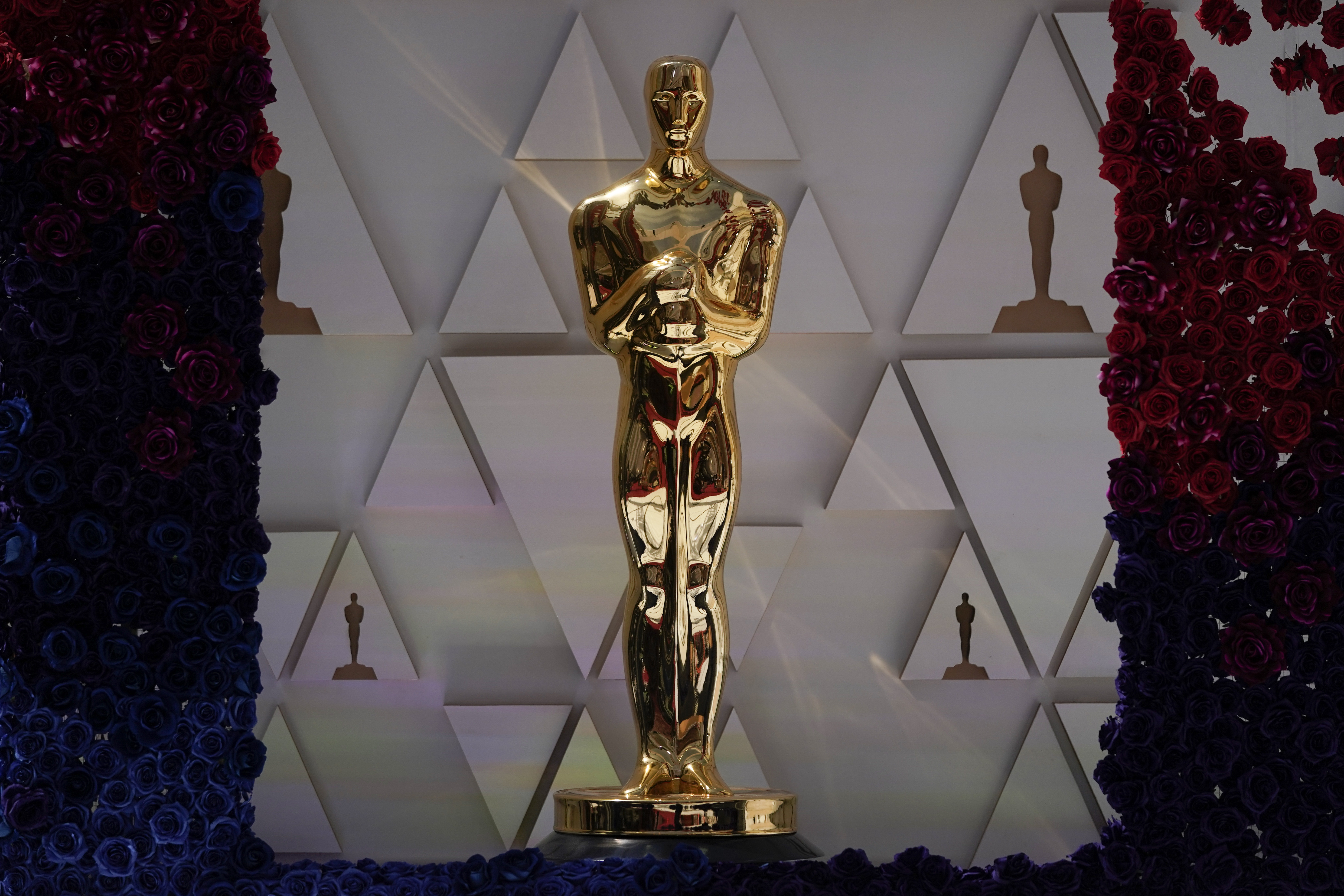 An Oscar statue sparkles in sunlight on the red carpet ahead of Sunday's 94th Academy Awards in the Hollywood section of Los Angeles, Saturday, March 26.