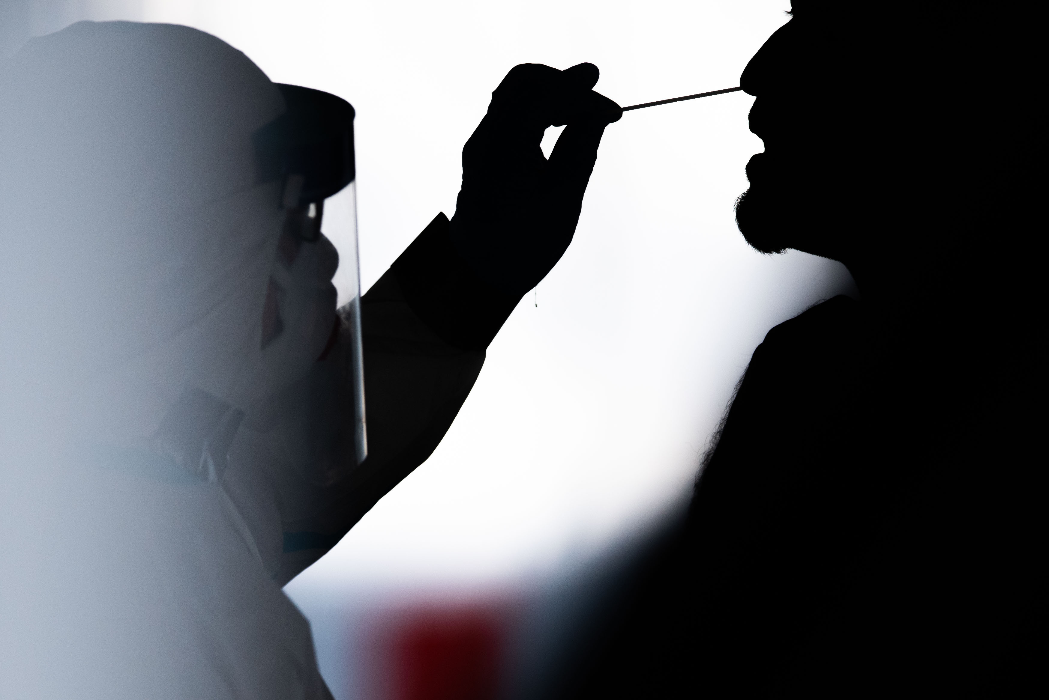 A man is tested for the coronavirus in a test center. After a severe corona outbreak in Garmisch-Partenkirchen, Upper Bavaria, it is still unclear what consequences the suspected culprit must expect. The authorities assume that the outbreak was caused by a so-called super-spreader.