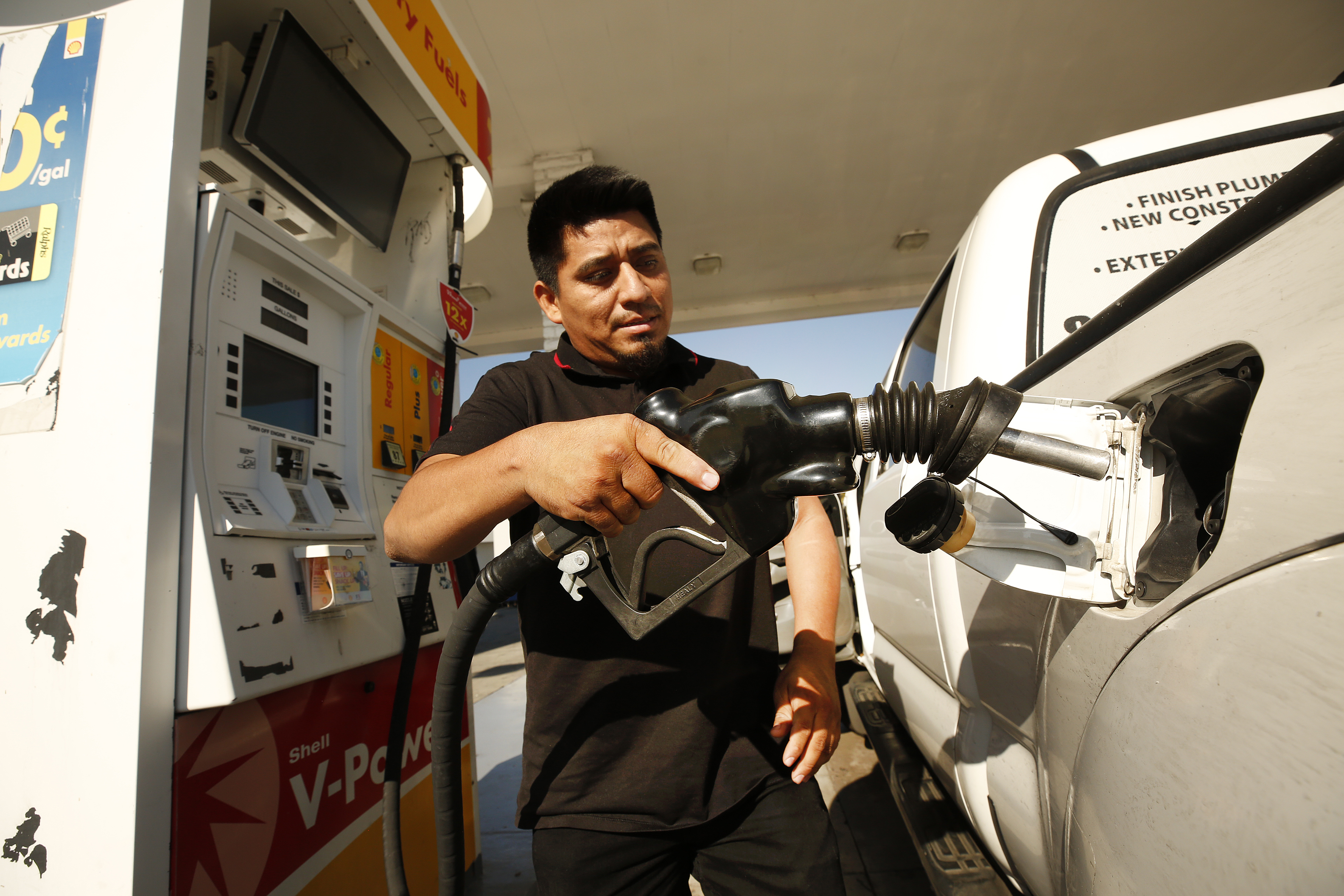 Man filling up his gas tank.