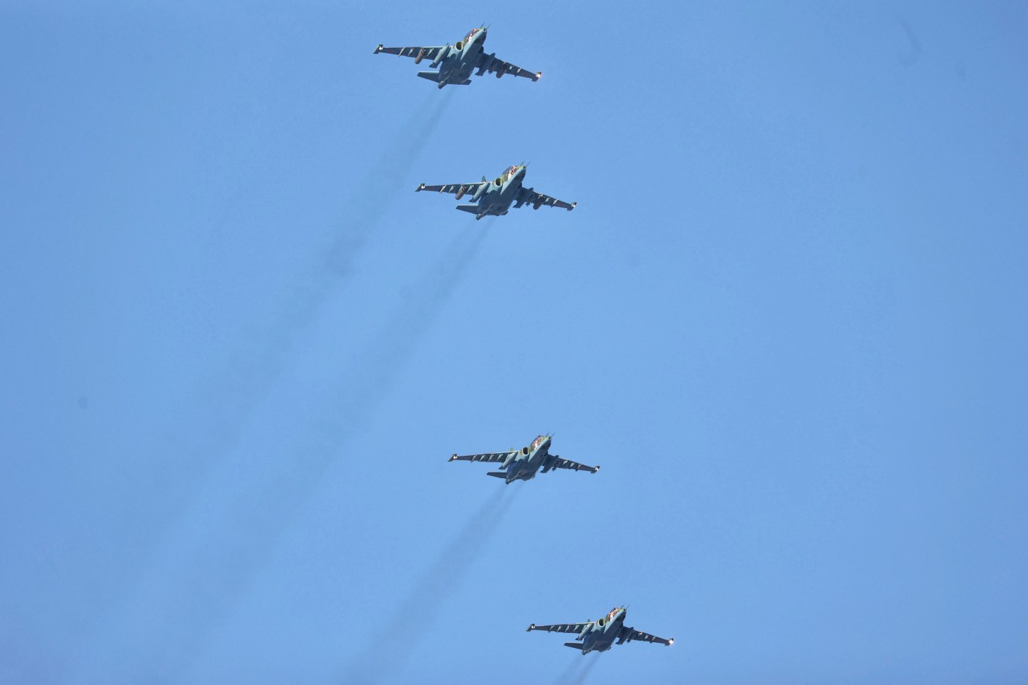Four fighter jets fly in the sky.