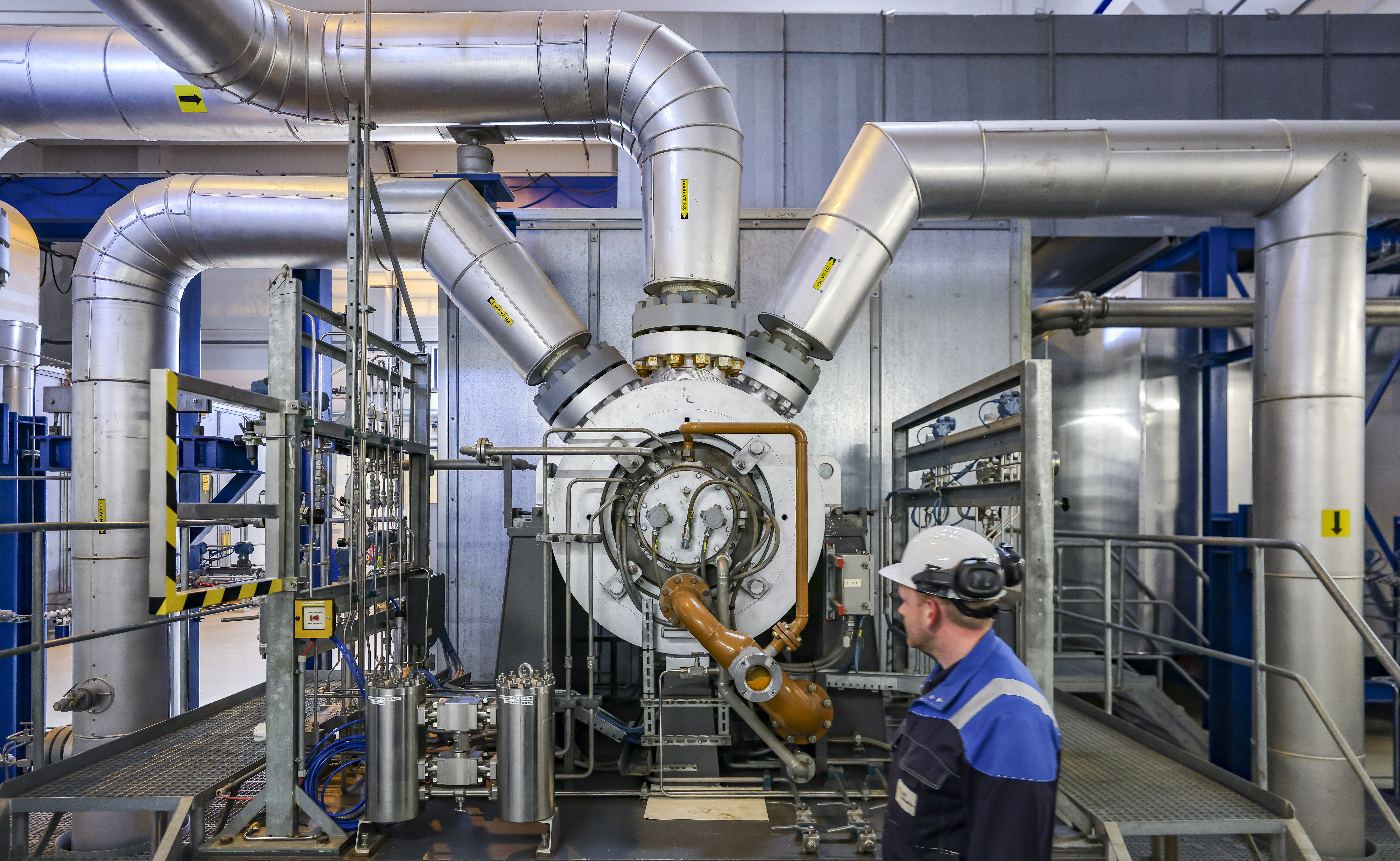 David Scheller, site foreman, walks along the compressor of VNG AG's underground gas storage facility in Saxony-Anhalt, Germany. The fill level of all the company's storage facilities is 25%, which is typical for the season. Scientists believe that a short-term supply stop of Russian gas would be manageable for the German economy. However, this would require more liquefied gas to be procured on the world market.