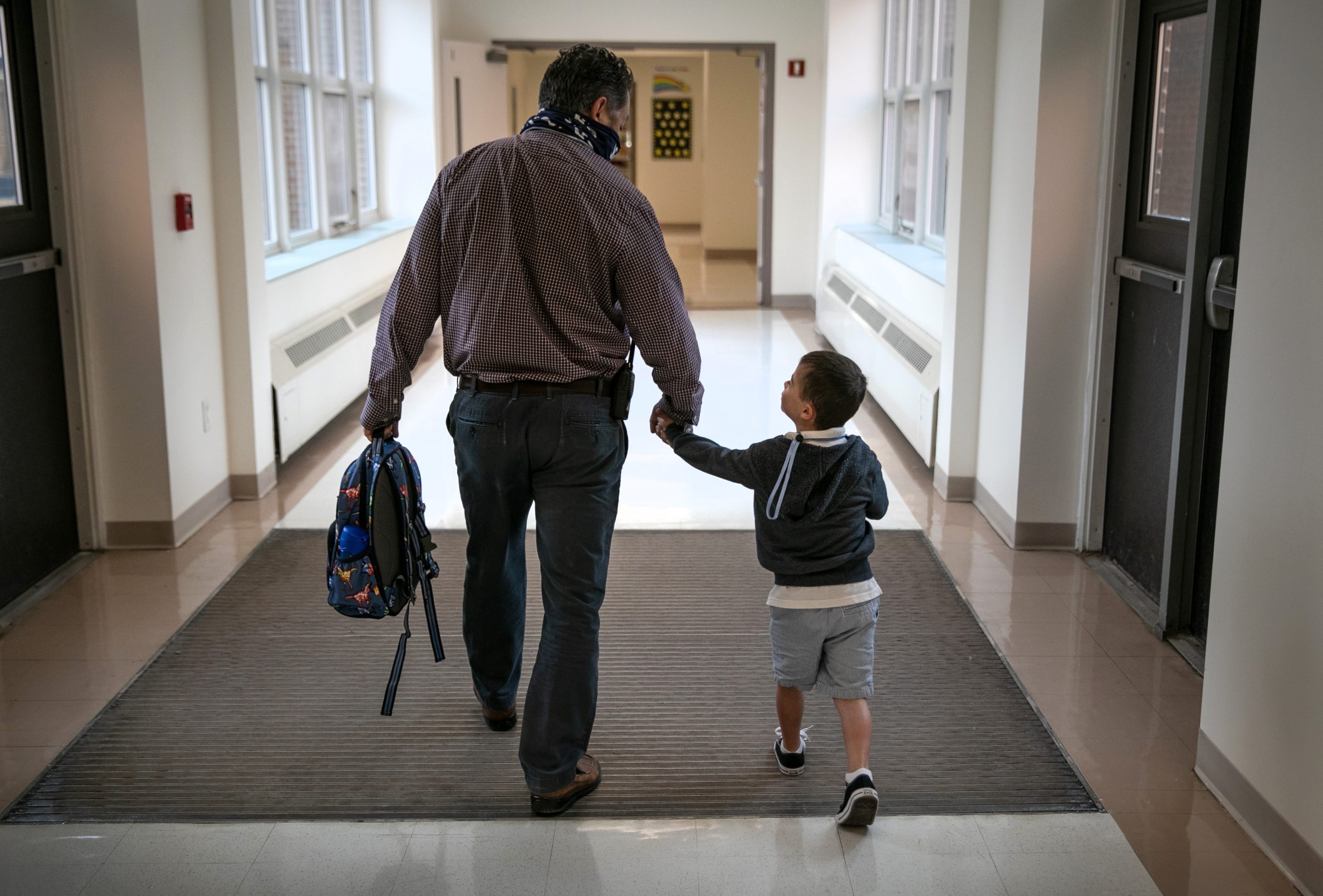 Father dropping off son at school