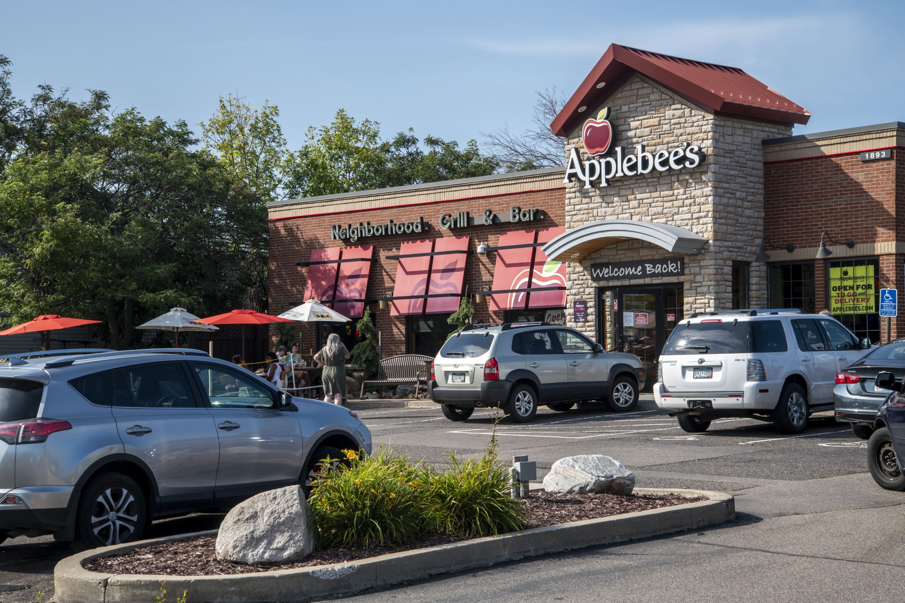 People enjoy the outdoor patio at Applebee's restaurant