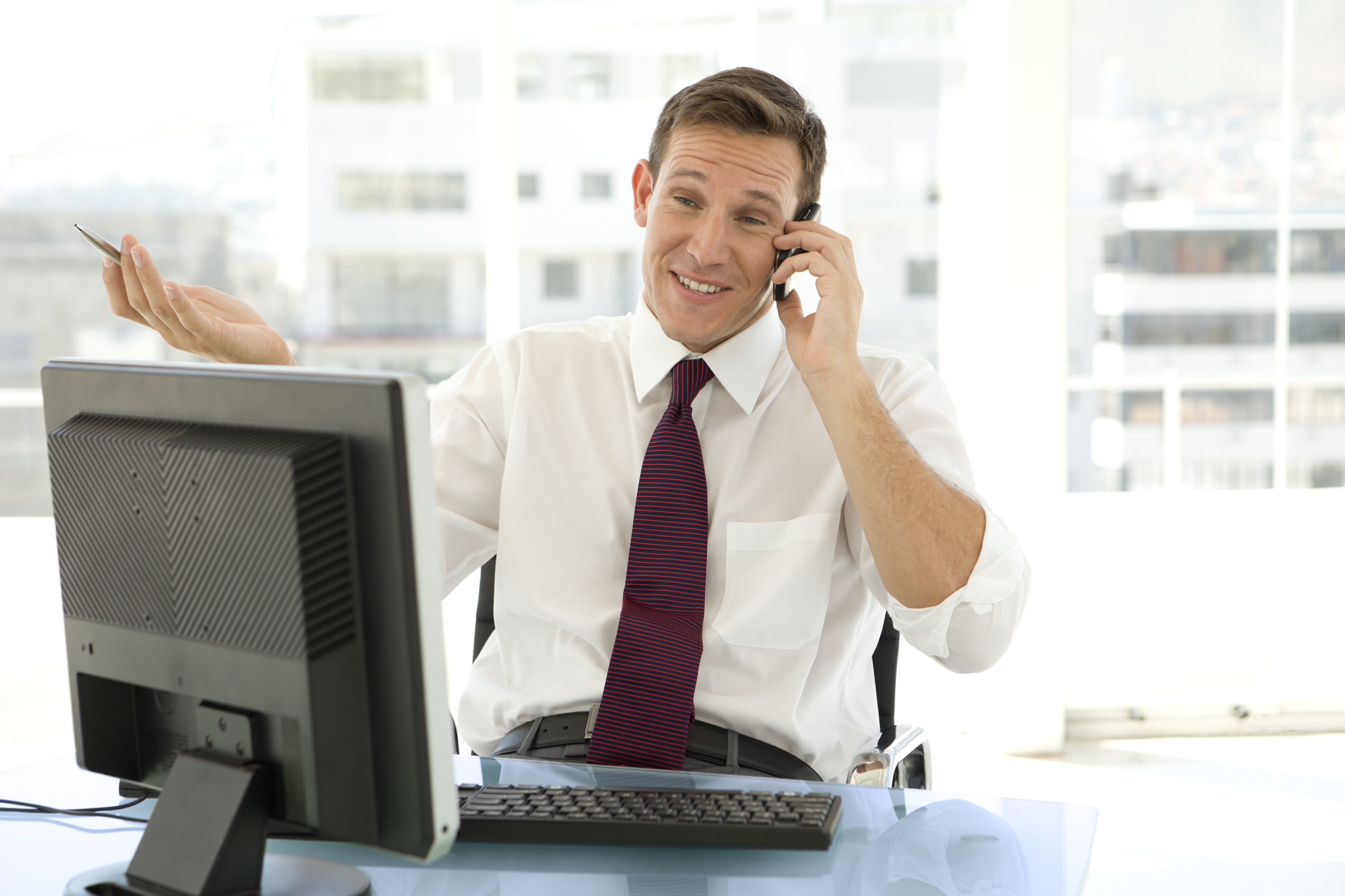 Salesman on the phone at workplace