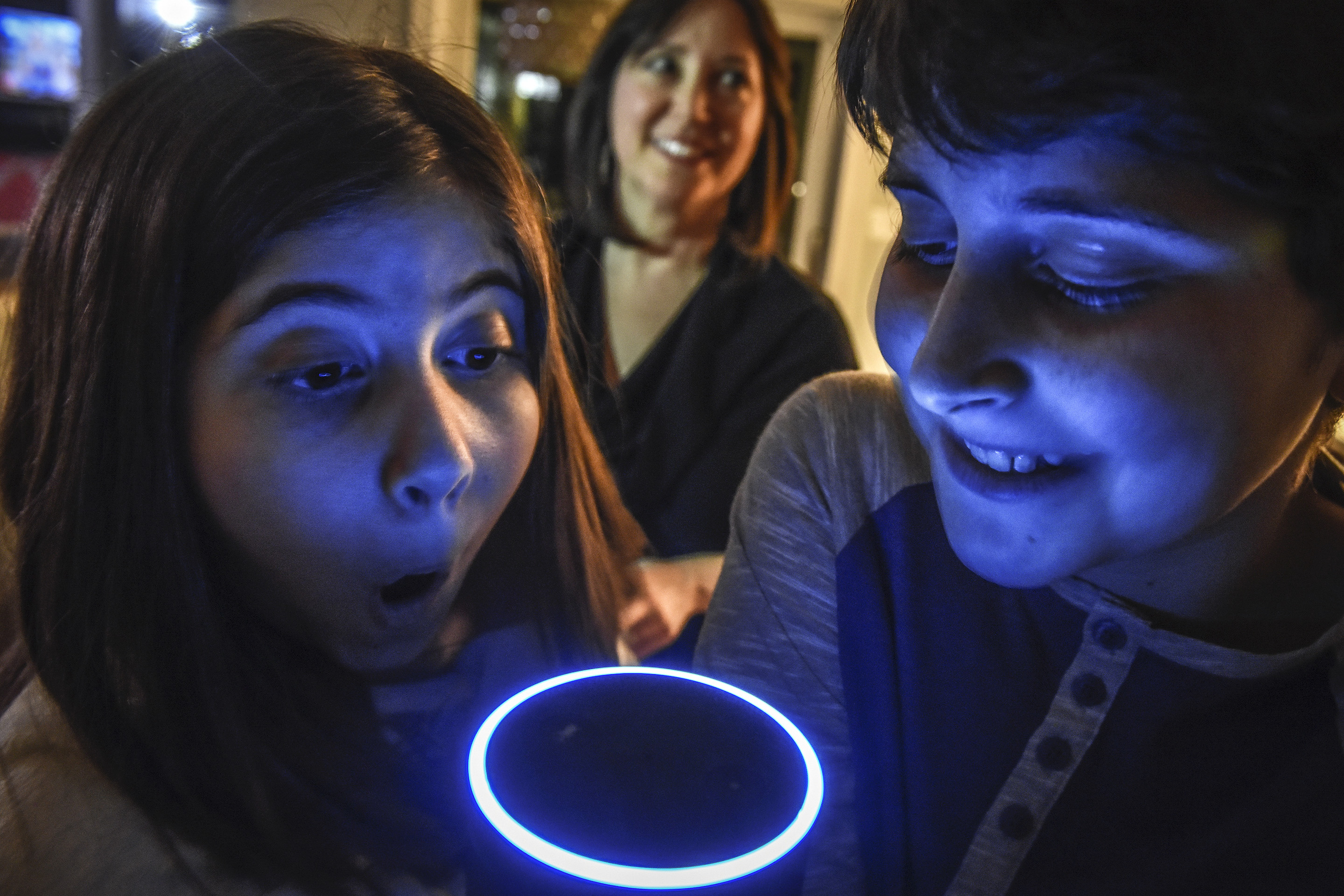 Laura Labovich and her children, Asher and Emerson, with their family Alexa device.