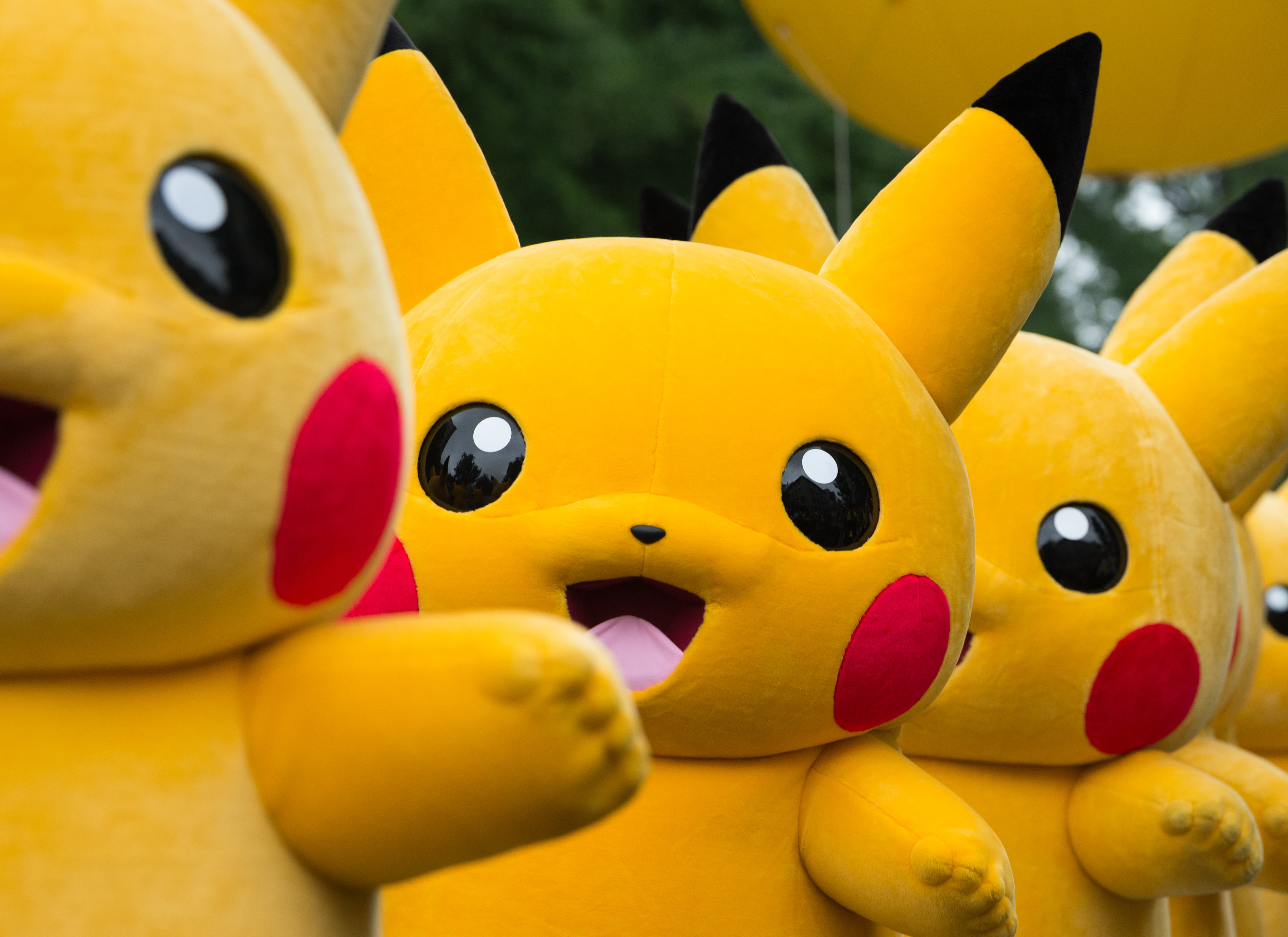 Performers dressed as the Pikachu character from Nintendo Co.'s Pokemon franchise march during the Pikachu Carnival Parade organized by Pokemon Co. in Yokohama, Japan, on Monday, Aug. 14, 2017.