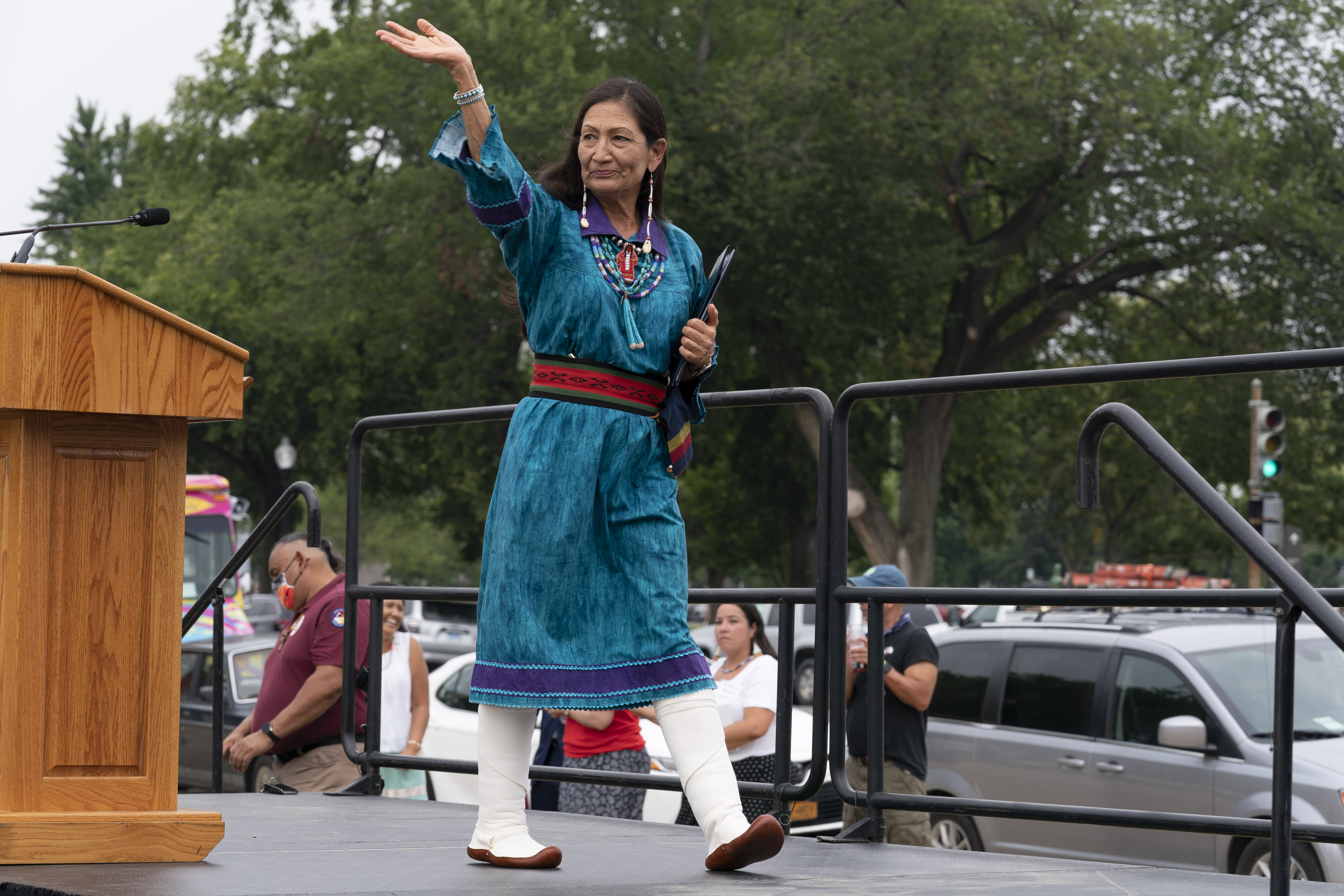 Interior Secretary Deb Haaland waves after speaking to a crowd during a totem pole delivery ceremony by Native American tribal leaders and Indigenous activists, on Capitol Hill in Washington on July 29, 2021. Secretary Haaland vowed on her first day on the job to ensure Native American tribes have opportunities to speak with her and the agencies she oversees. Native American and Alaska Native groups are seeing change under Haaland but some remain frustrated with the pace of action.