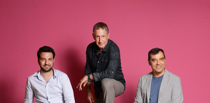 Portrait of AI21 Labs co-founders Ori Goshen (left), Yoav Shoham (center), and Amnon Shoshua