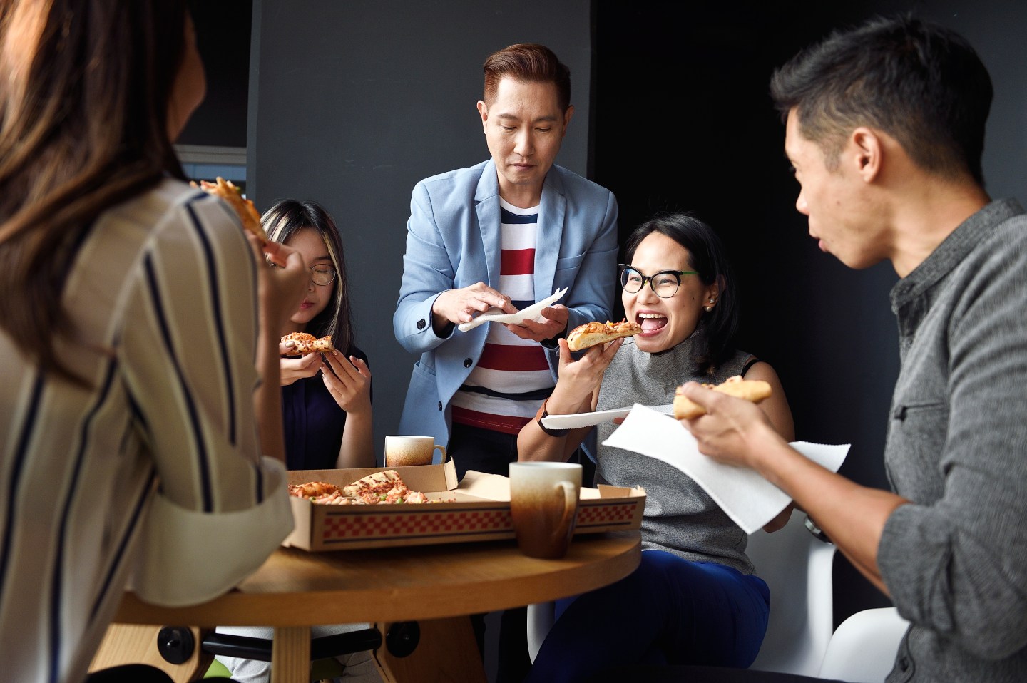 work friends eating pizza