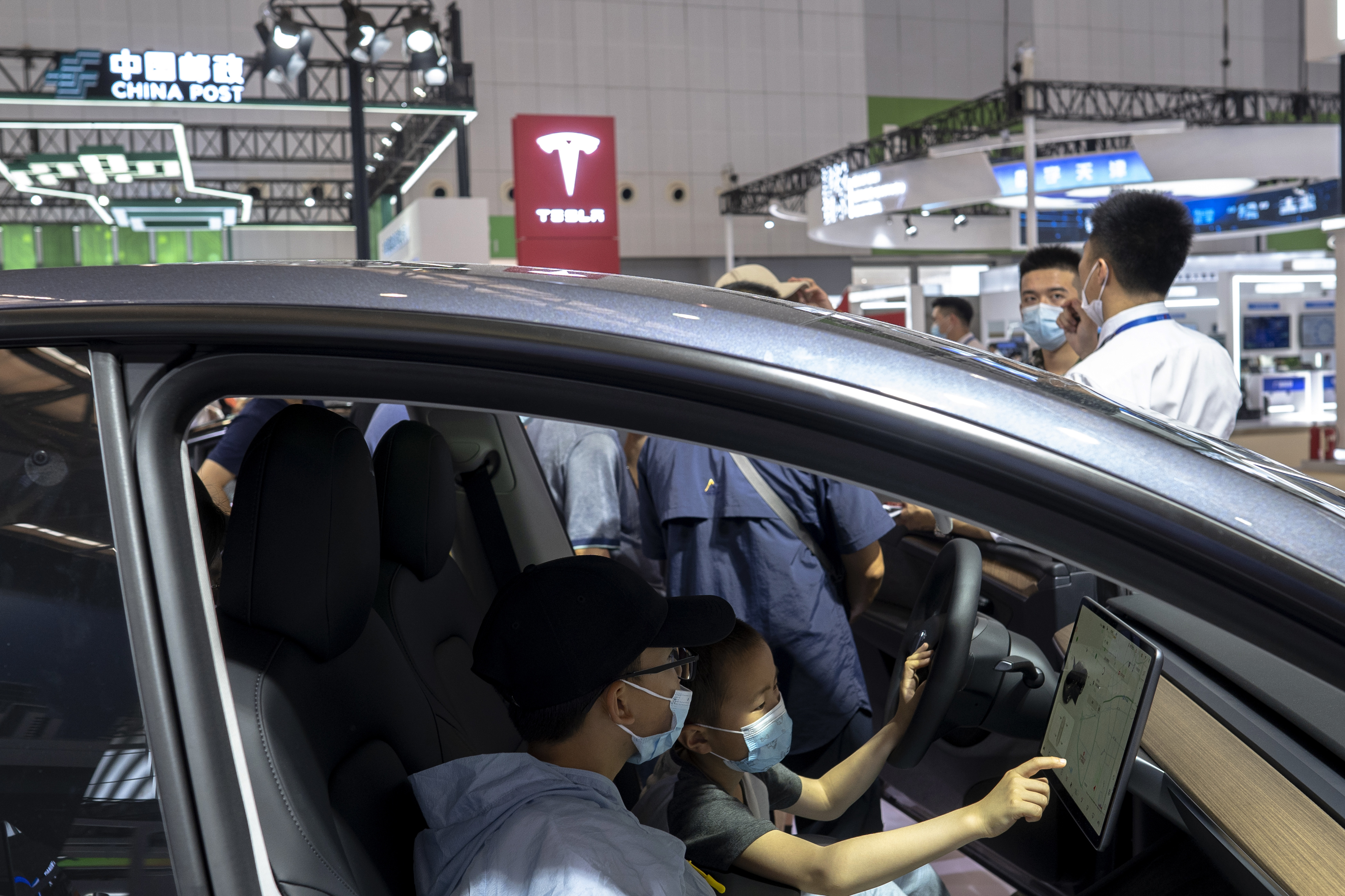 Two kids in the driver's cab, have shown great interest in