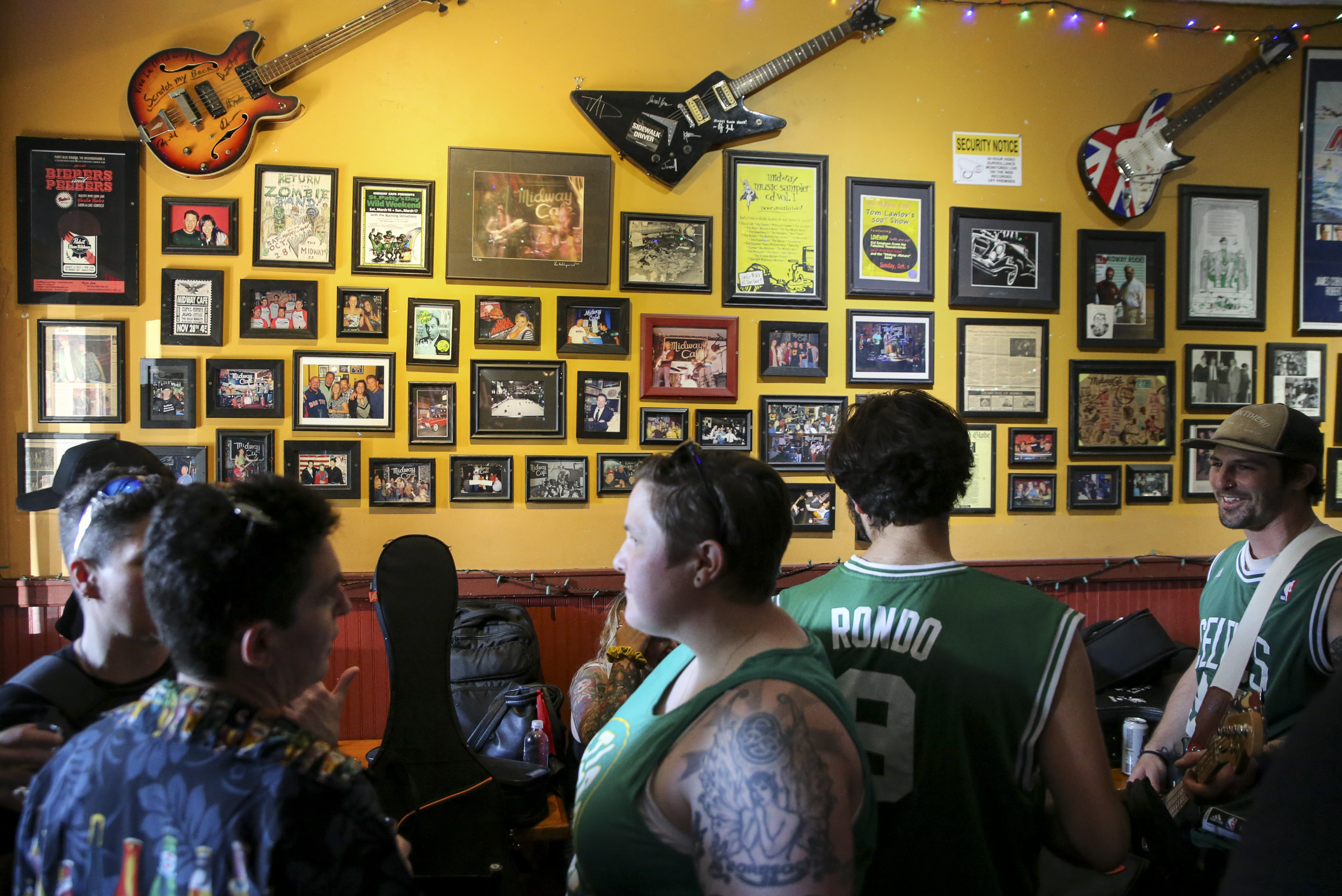 Friends gather at Midway Cafe for a live music event In Boston's Jamaica Plain on June 13, 2021.