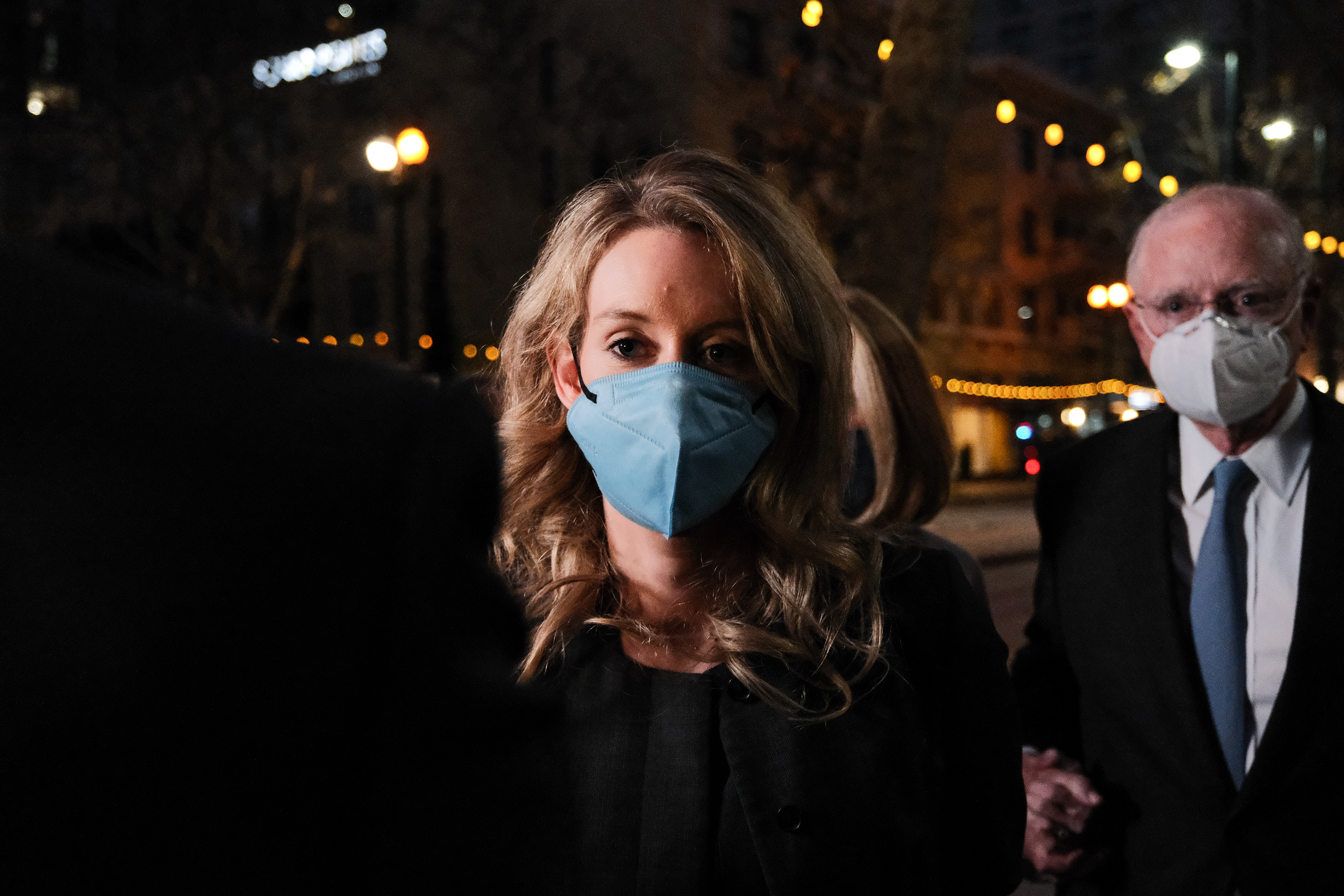 Theranos founder and former CEO Elizabeth Holmes and her lawyer leave the Robert F. Peckham Federal Building on January 3, 2022 in San Jose, California. A jury found Elizabeth Holmes guilty on three counts of wire fraud and one count of conspiracy to defraud investors.