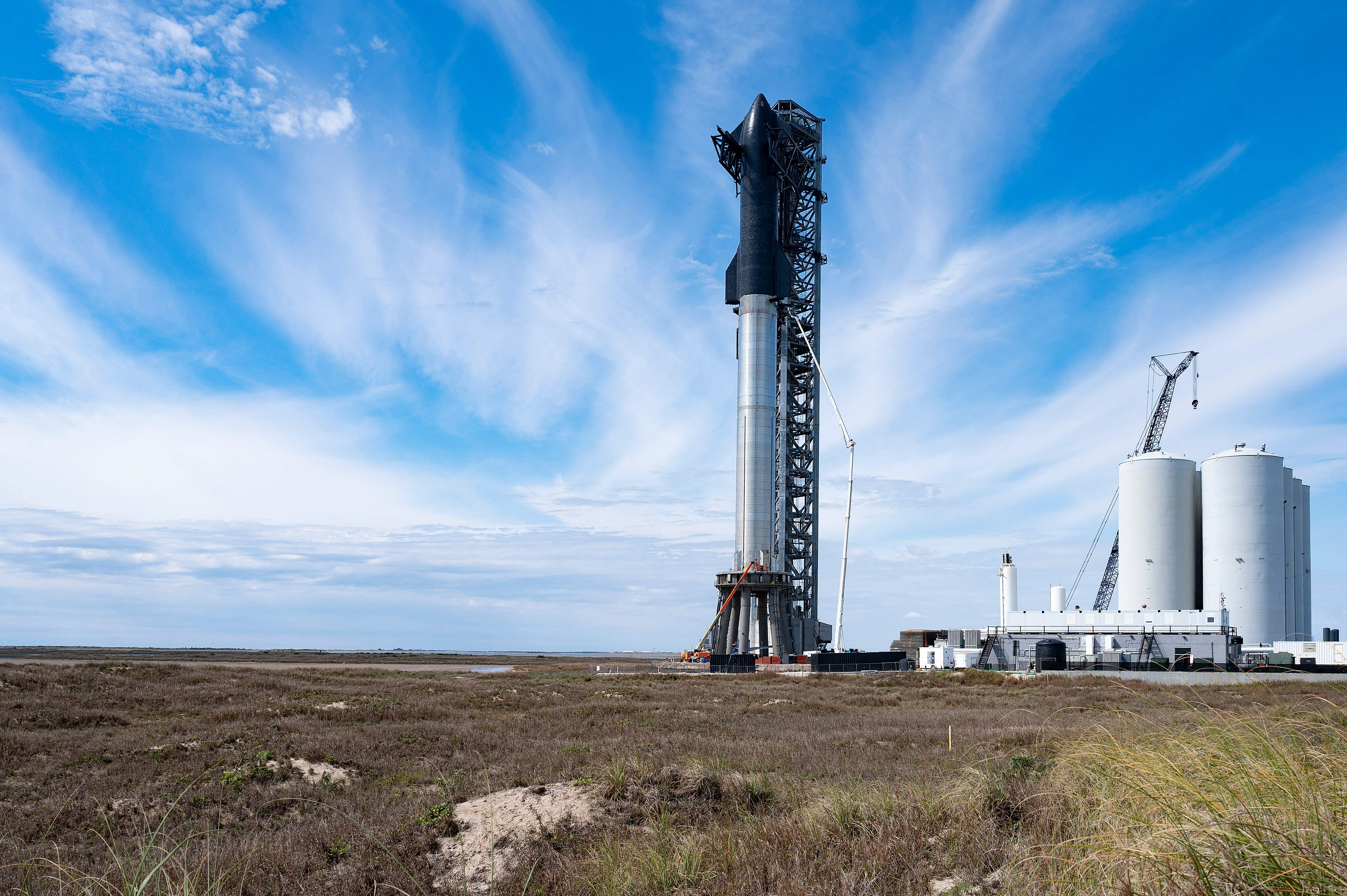 SpaceX's first orbital Starship SN20 is stacked atop its massive Super Heavy Booster 4 at the company's Starbase facility near Boca Chica Village in South Texas on Feb. 10, 2022. 