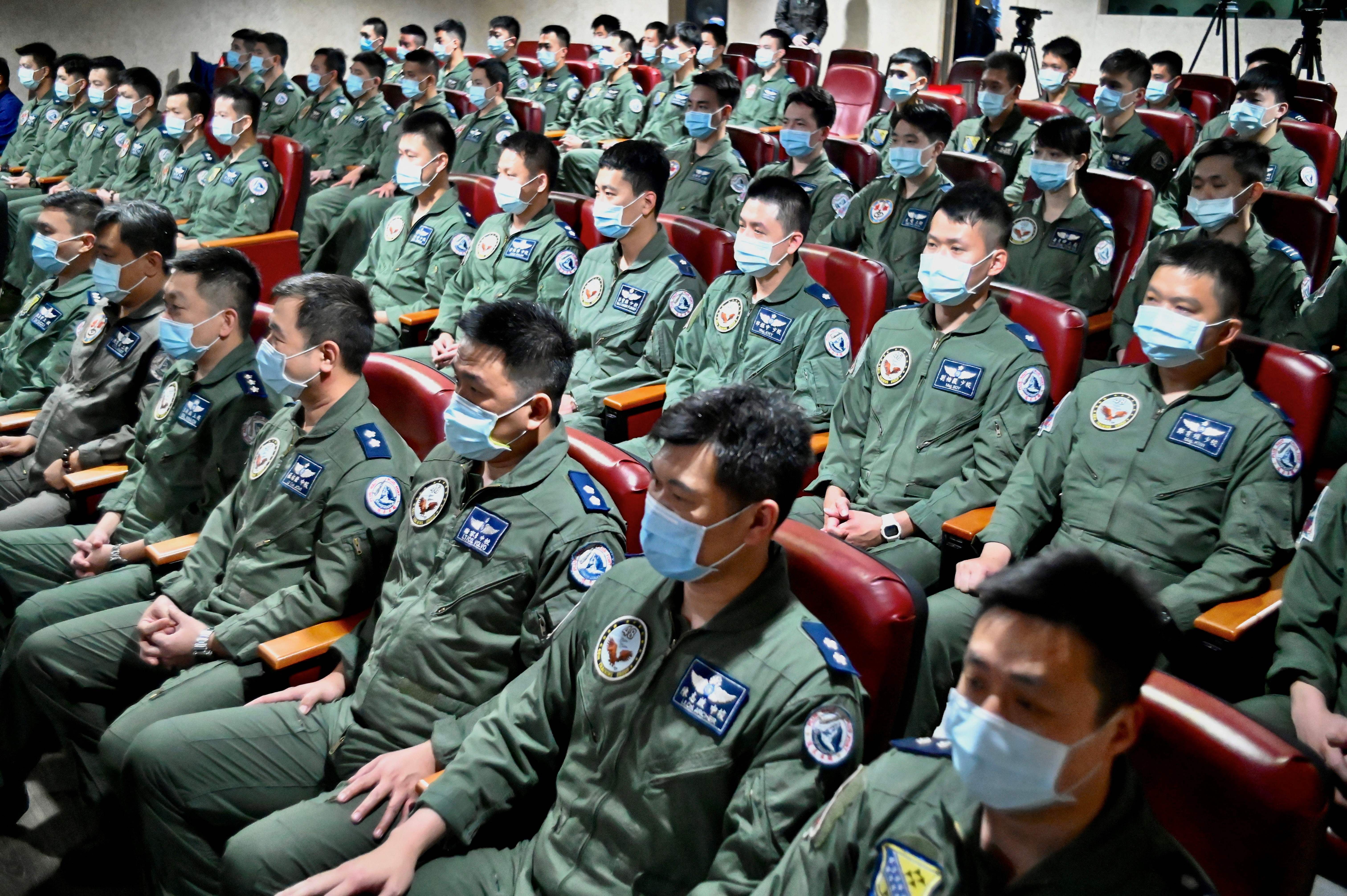 Taiwanese Air Force pilots listen to a speech by President Tsai Ing-wen at a military base in Hsinchu on April 1, 2022. 