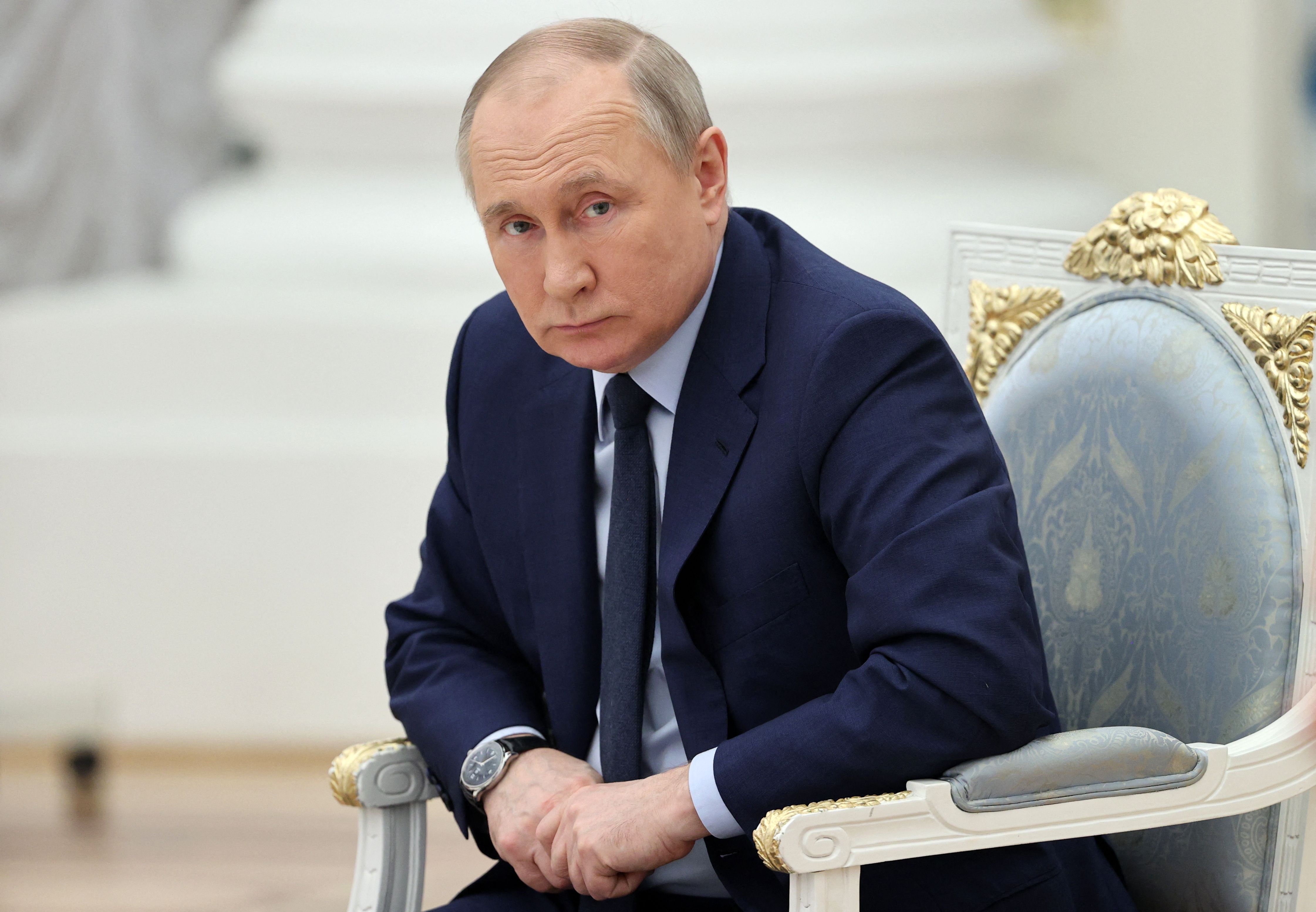 Russian President Vladimir Putin looks on as he holds a meeting of the Russia - Land of Opportunity platform supervisory board at the Catherine's Hall of the Kremlin in Moscow on April 20.