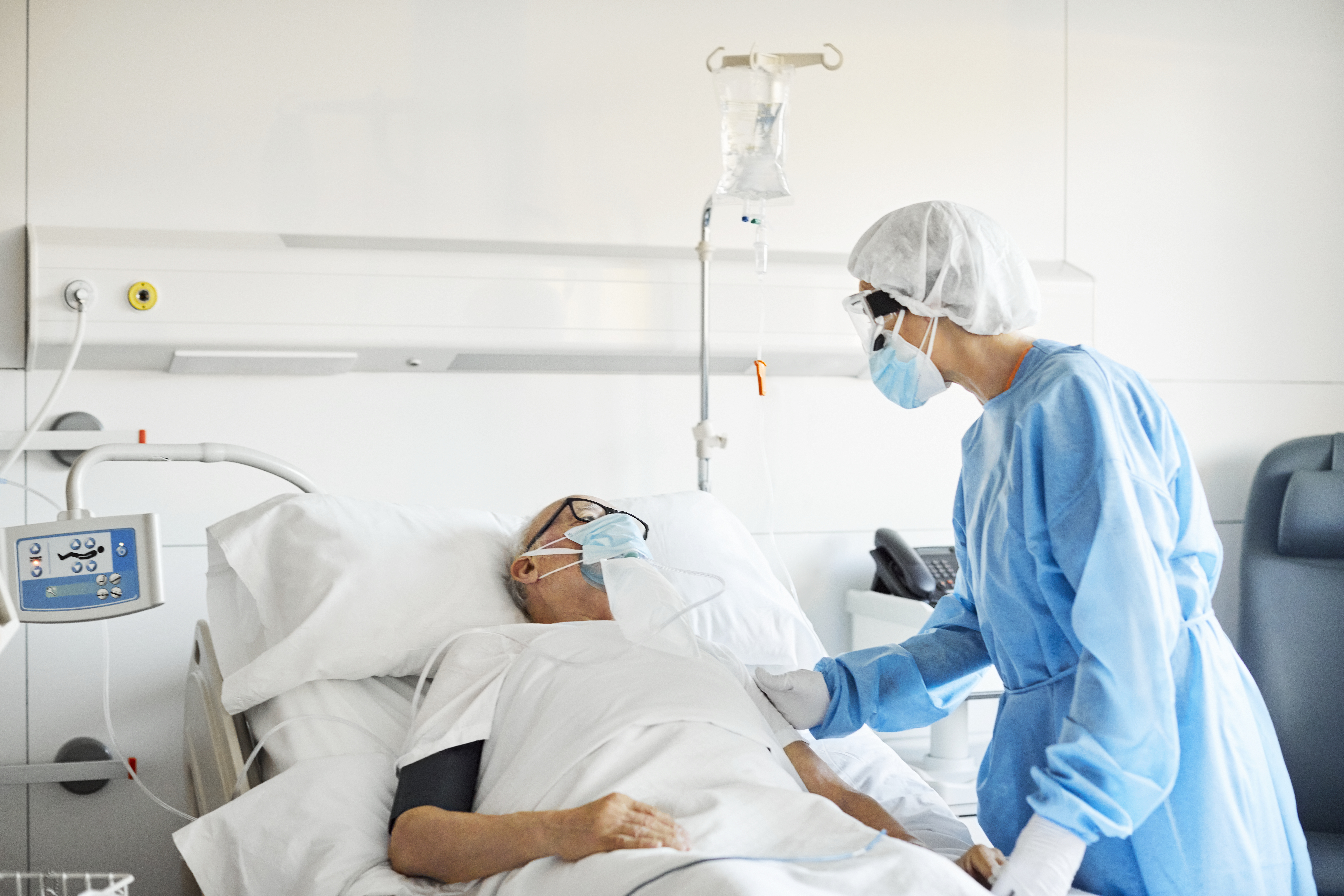 A man in a hospital bed.