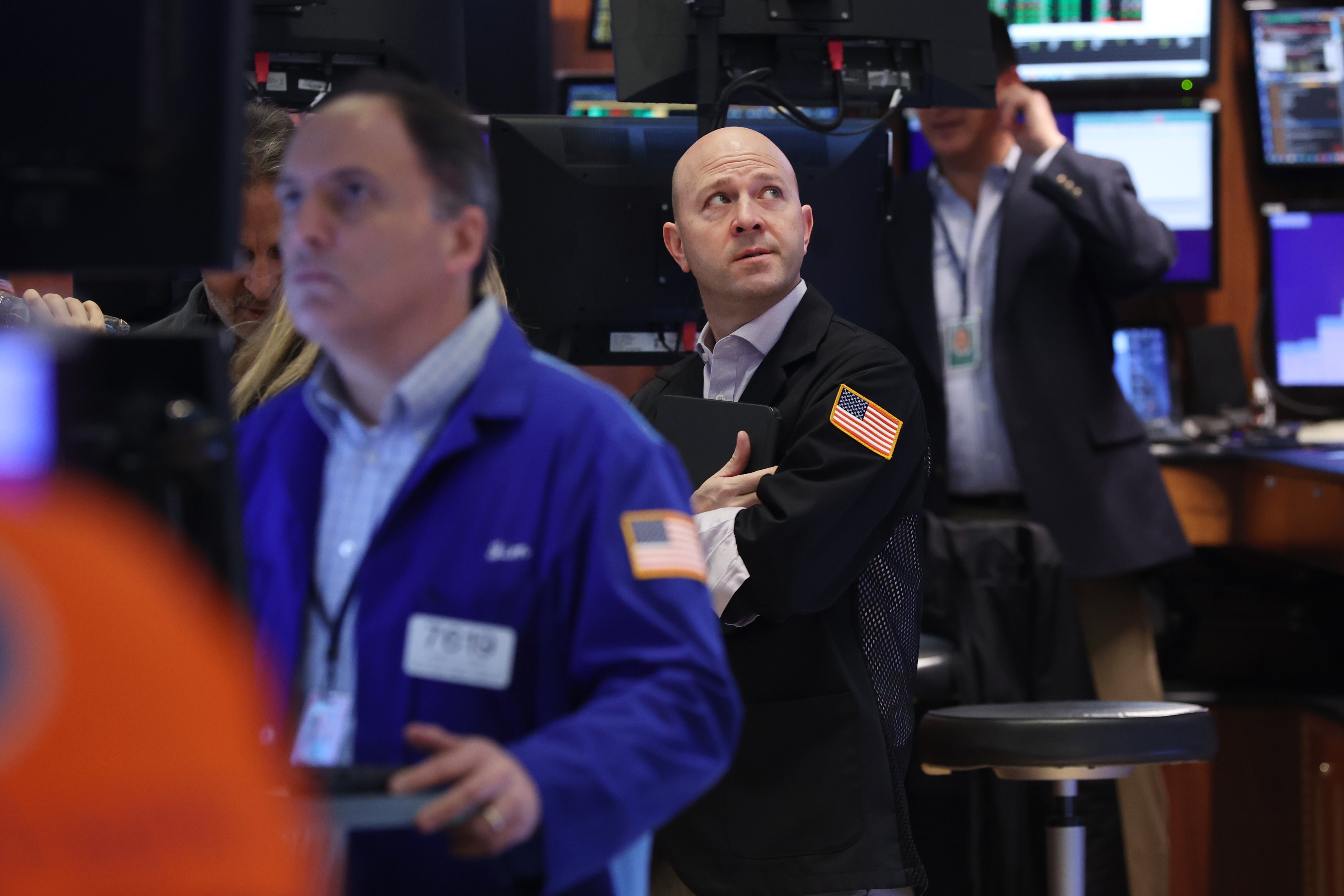 Traders work on the floor of the New York Stock Exchange in New York City. Goldman Sachs sees a 38% chance the United States will fall into recession.