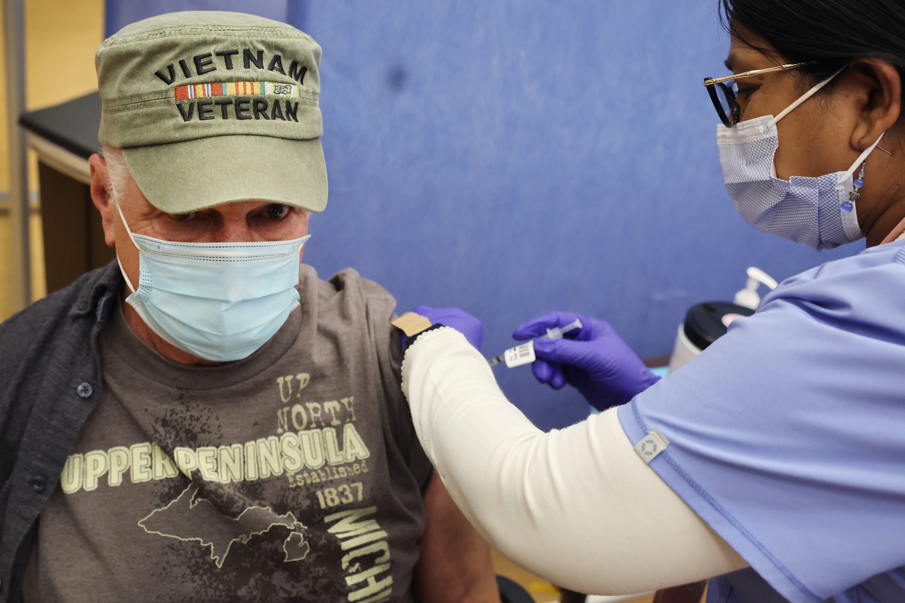 A veteran receives a COVID vaccine booster shot in Illinois