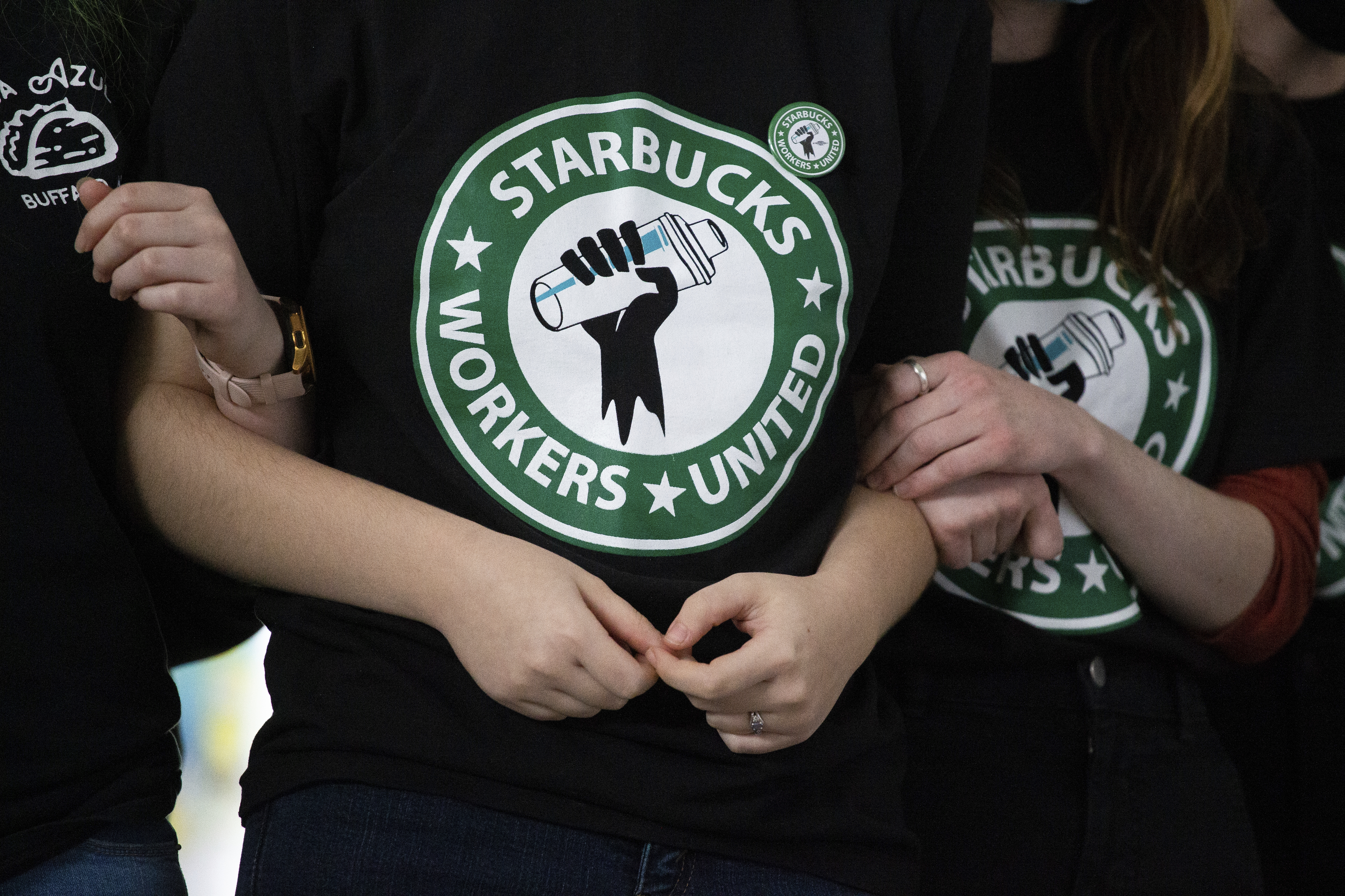 Starbucks employees and supporters react as votes are read during a union-election watch party on Thursday, Dec. 9, 2021, in Buffalo, N.Y. It’s become a common sight: jubilant Starbucks workers celebrating after successful votes to unionize at dozens of U.S. stores. But when the celebrations die down, a daunting hurdle remains. To win the changes they seek, like better pay and more reliable schedules, unionized stores must sit down with Starbucks and negotiate a contract. It’s a painstaking process that can take years.
