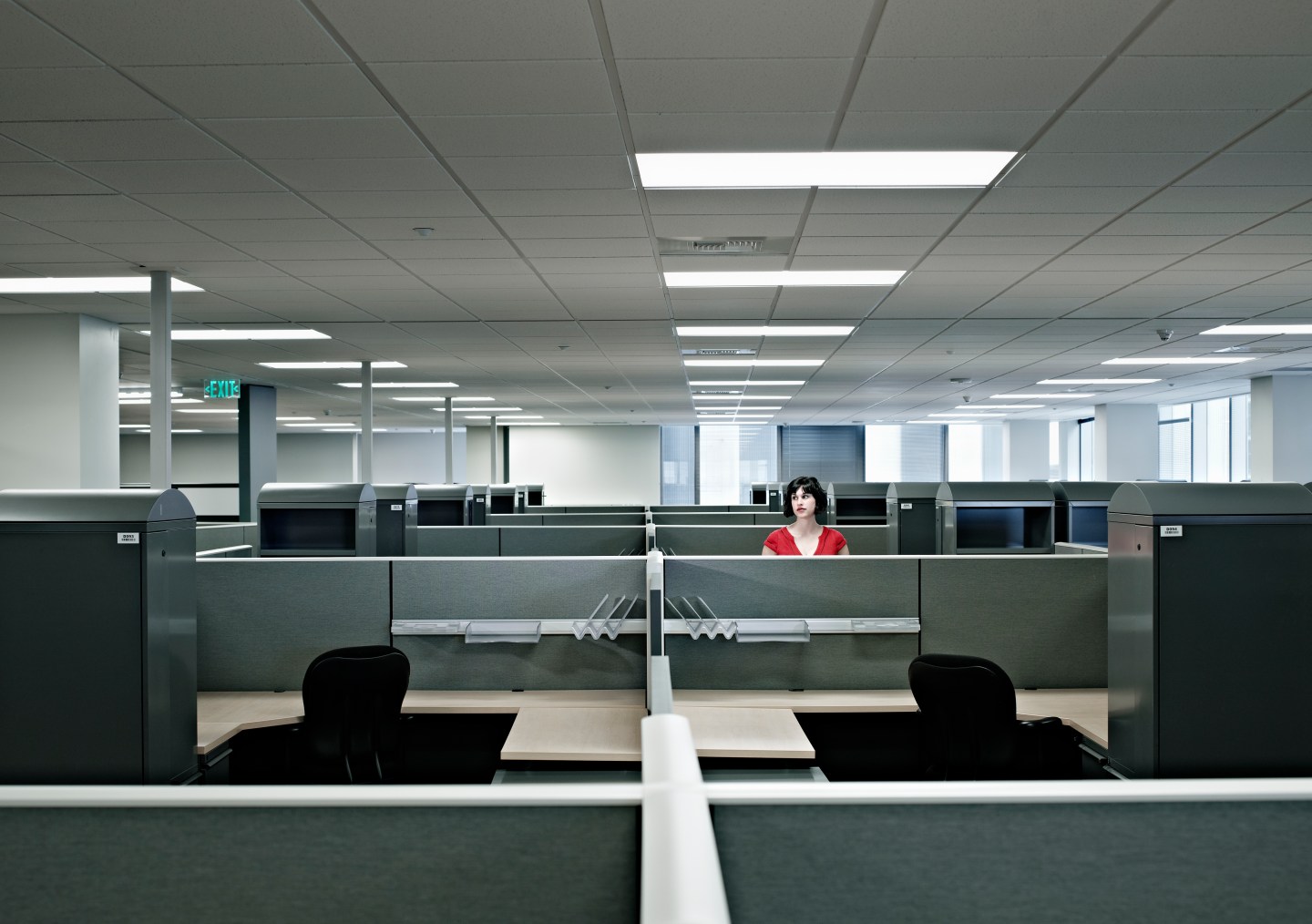 Businesswoman standing alone in empty office