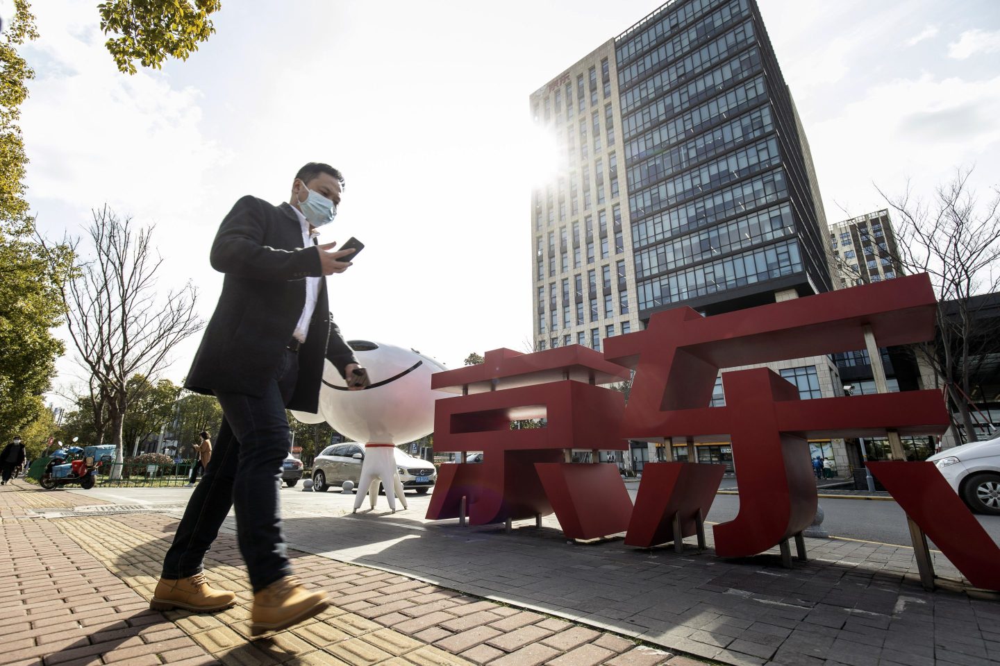A man walks past JD.com's office in Shanghai