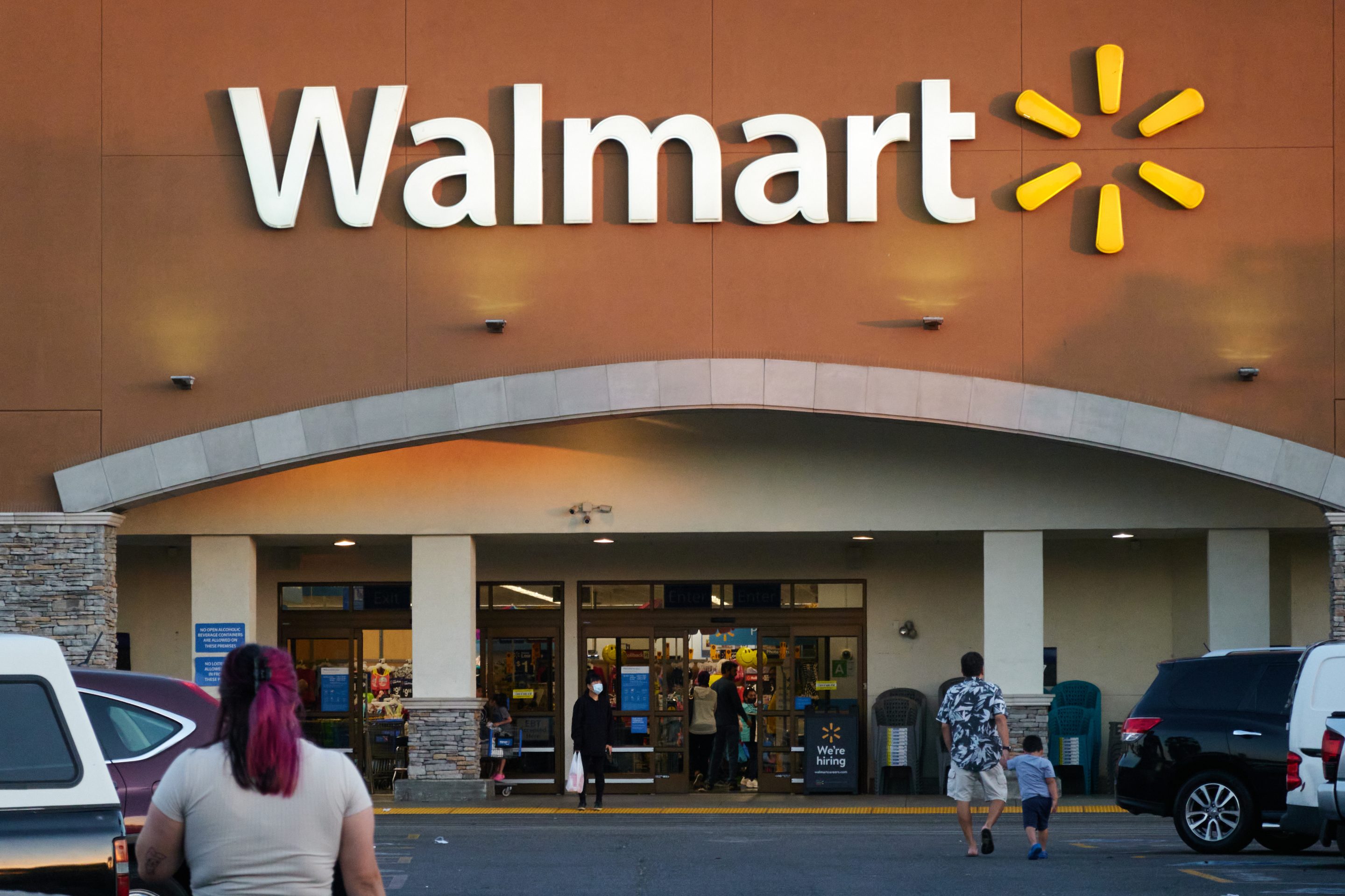 Customers outside at a Walmart store in Torrance, California, US, on Sunday, May 15, 2022. Walmart Inc. is scheduled to release earnings figures on May 17.