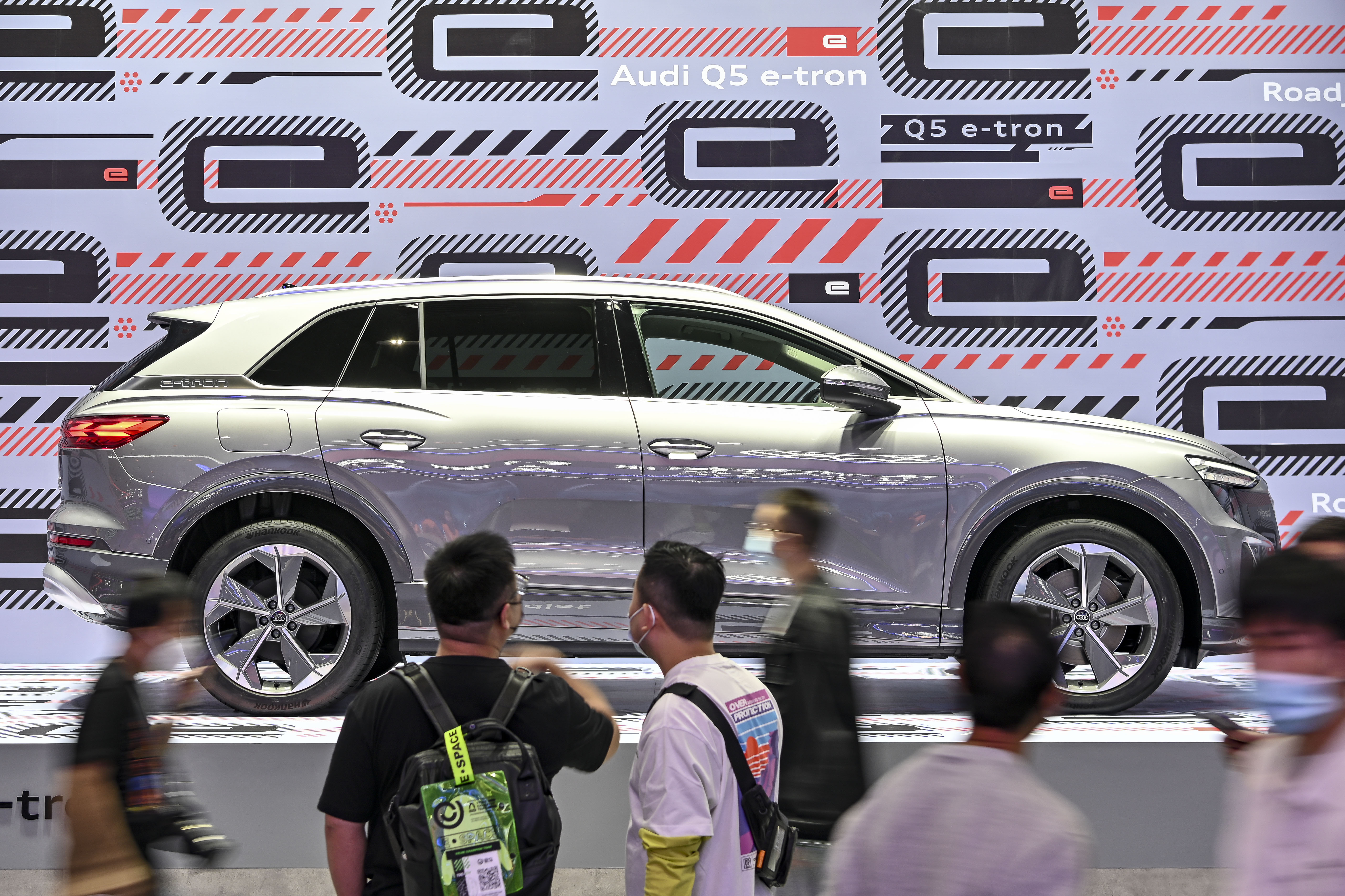 An Audi Q5 e-tron electric vehicle on display at an international auto show in 2021.