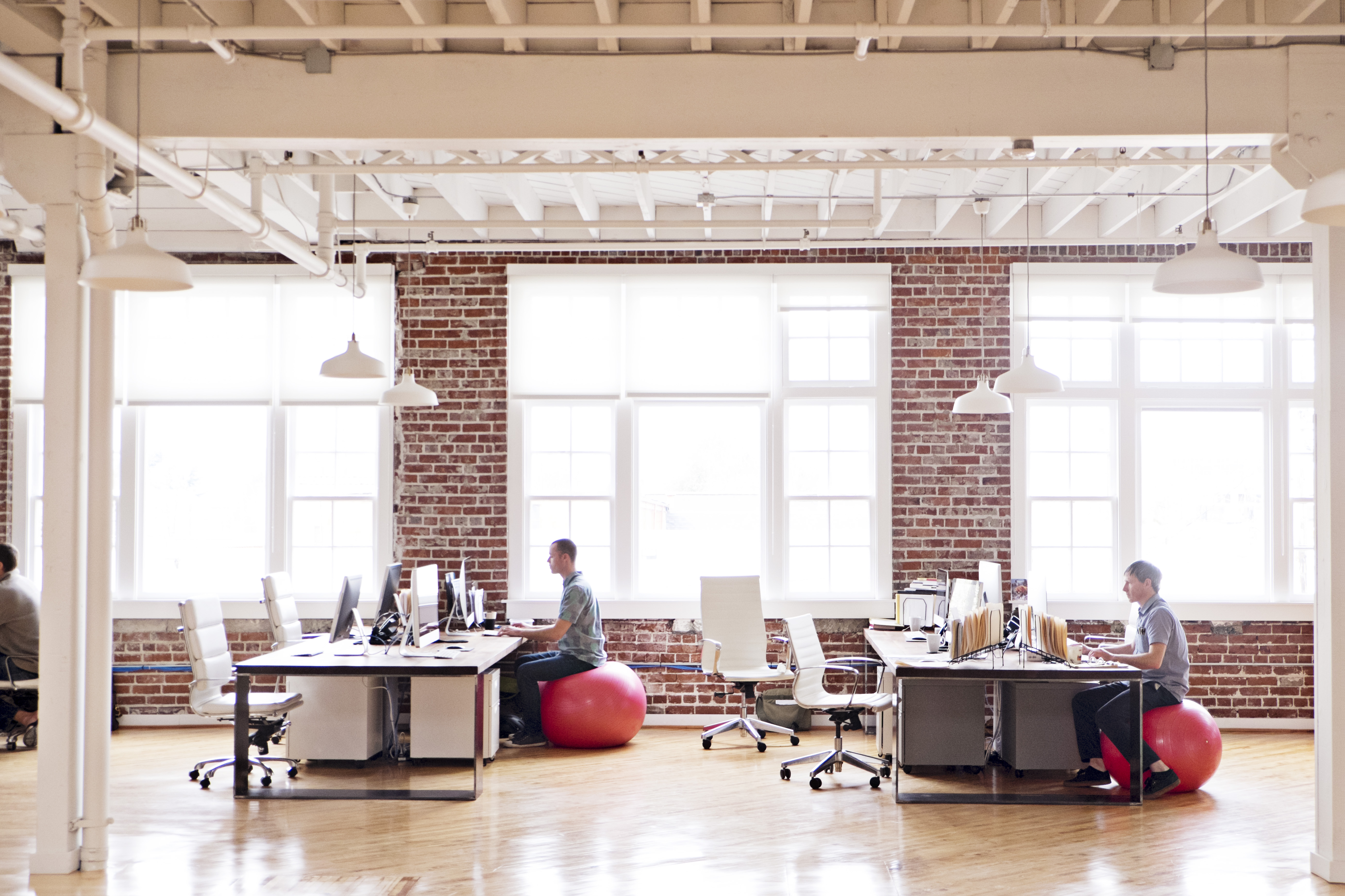 View of people working in an open-plan office