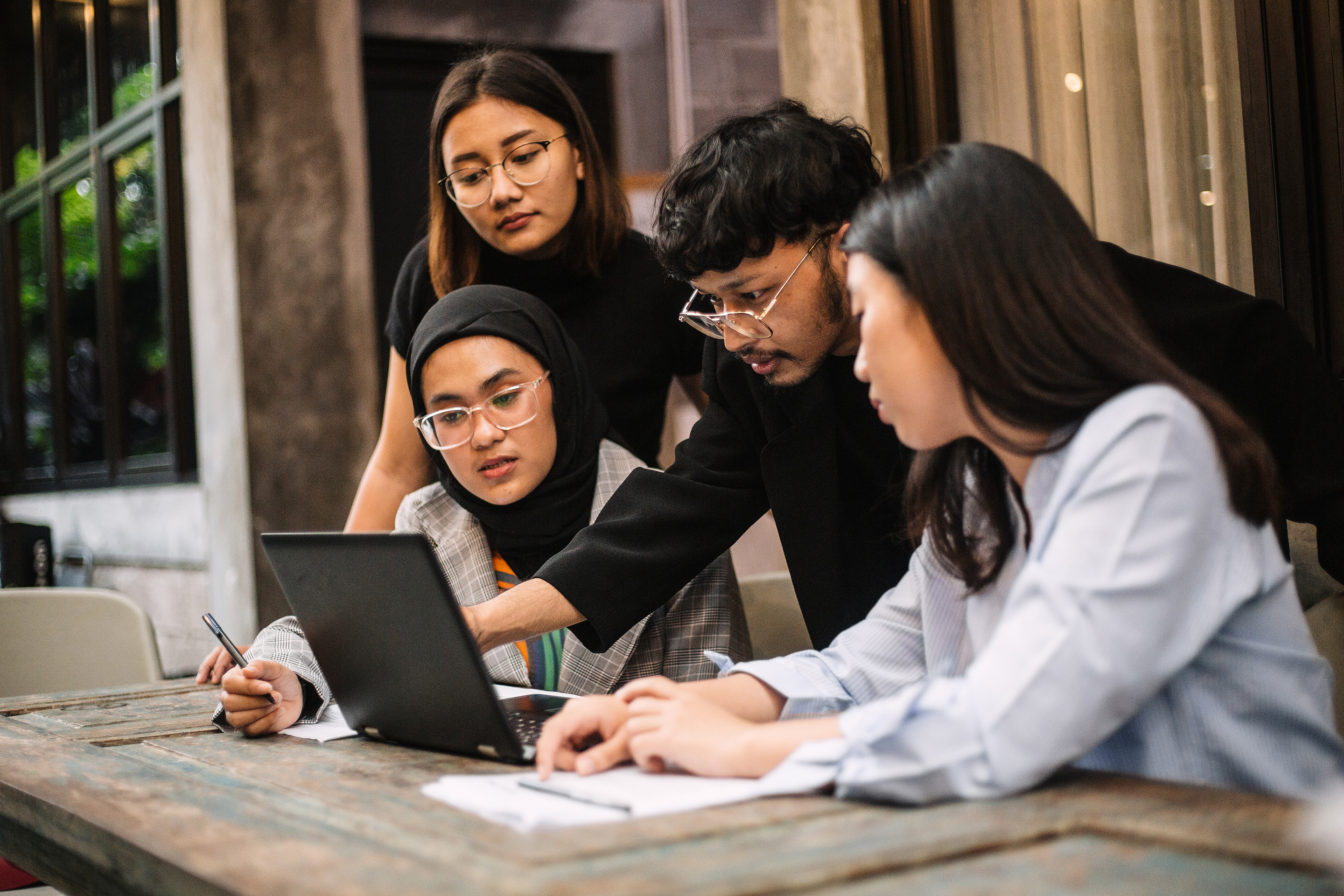 Meeting of young professionals in a co-working space