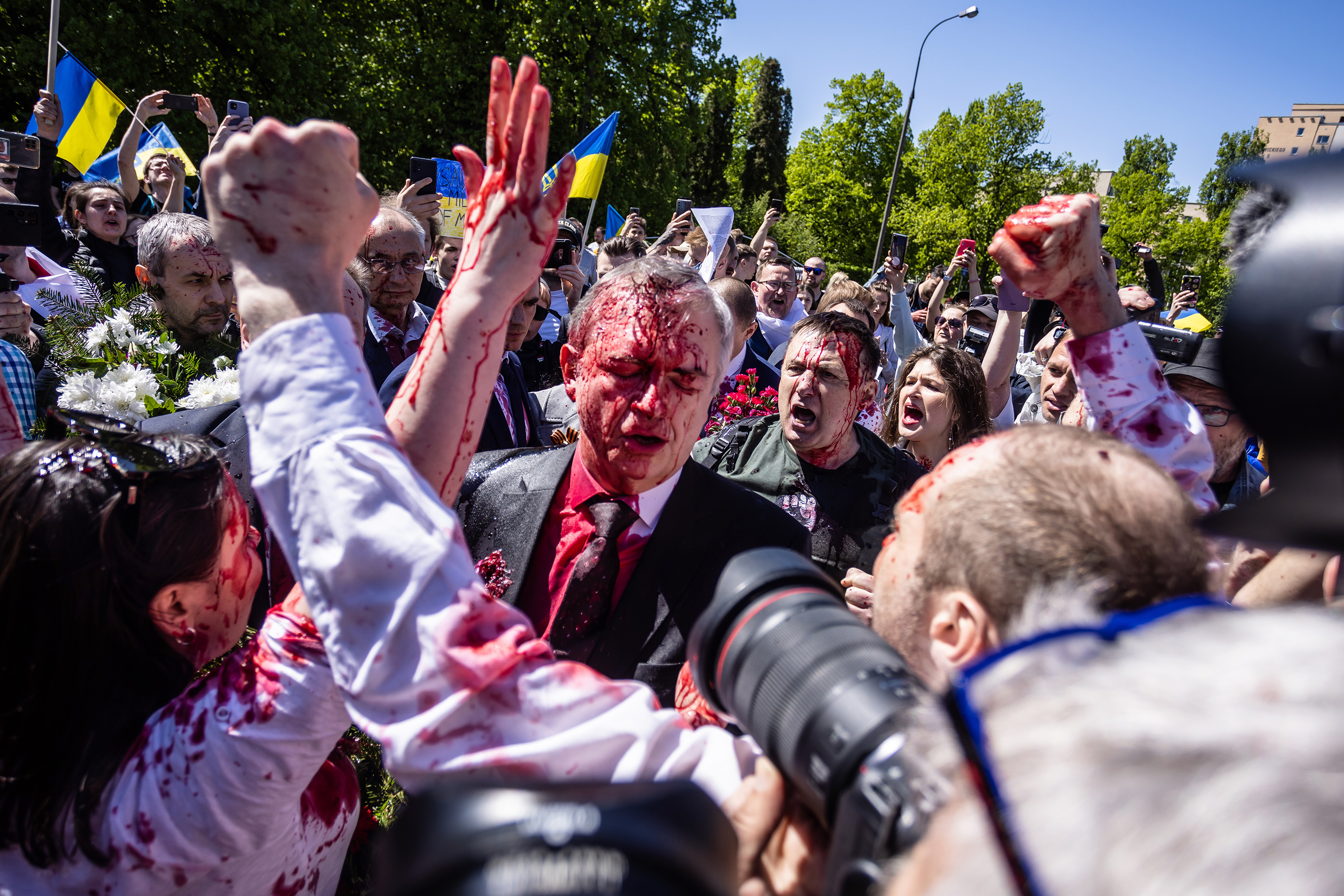 Russian Ambassador Sergey Andreev was doused in red paint by protesters on Monday in Warsaw, Poland.