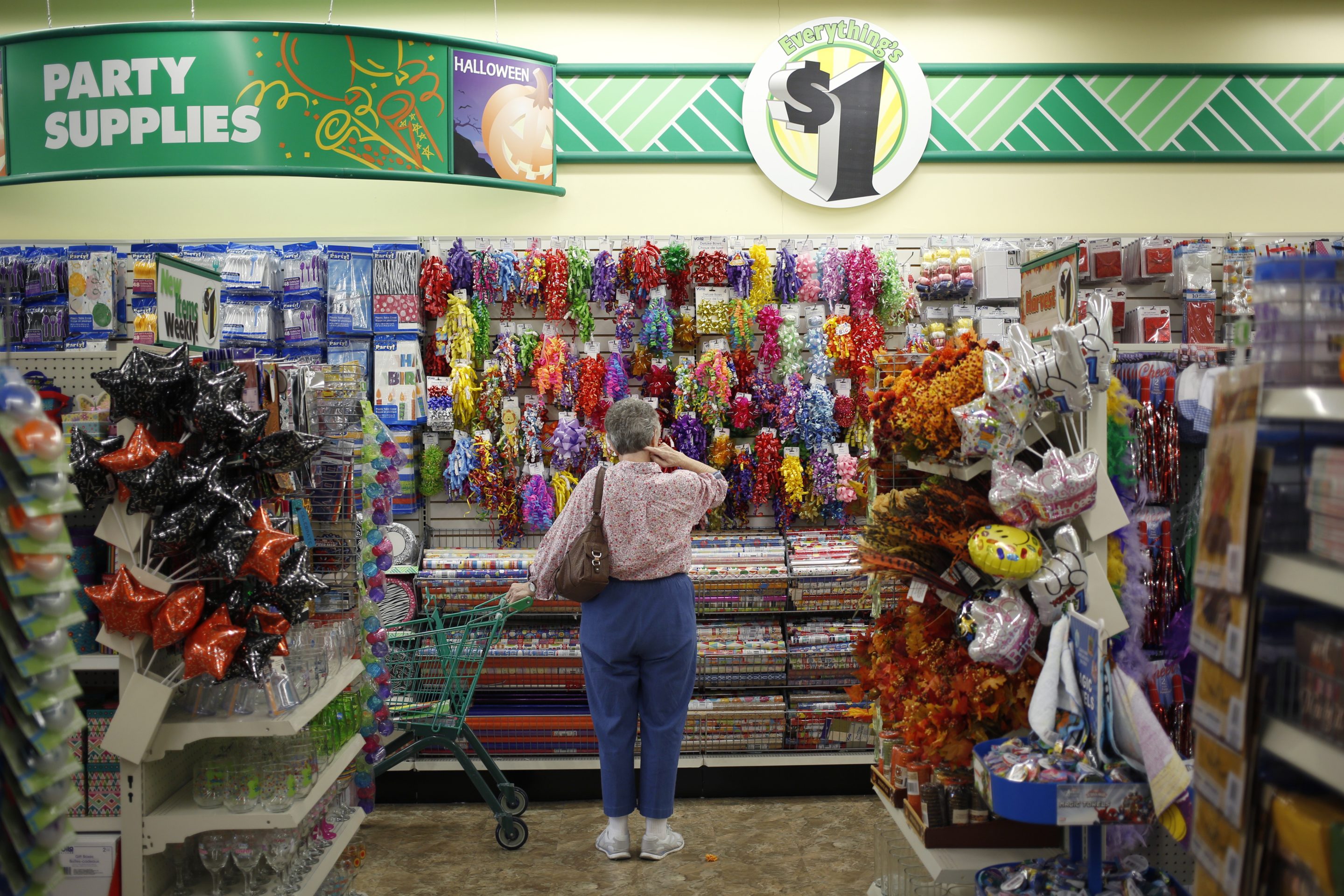 A customer browses gift wrapping supplies displayed for sale at a Dollar Tree Inc. store in Louisville, Kentucky, U.S., on Friday, Aug. 24, 2018.