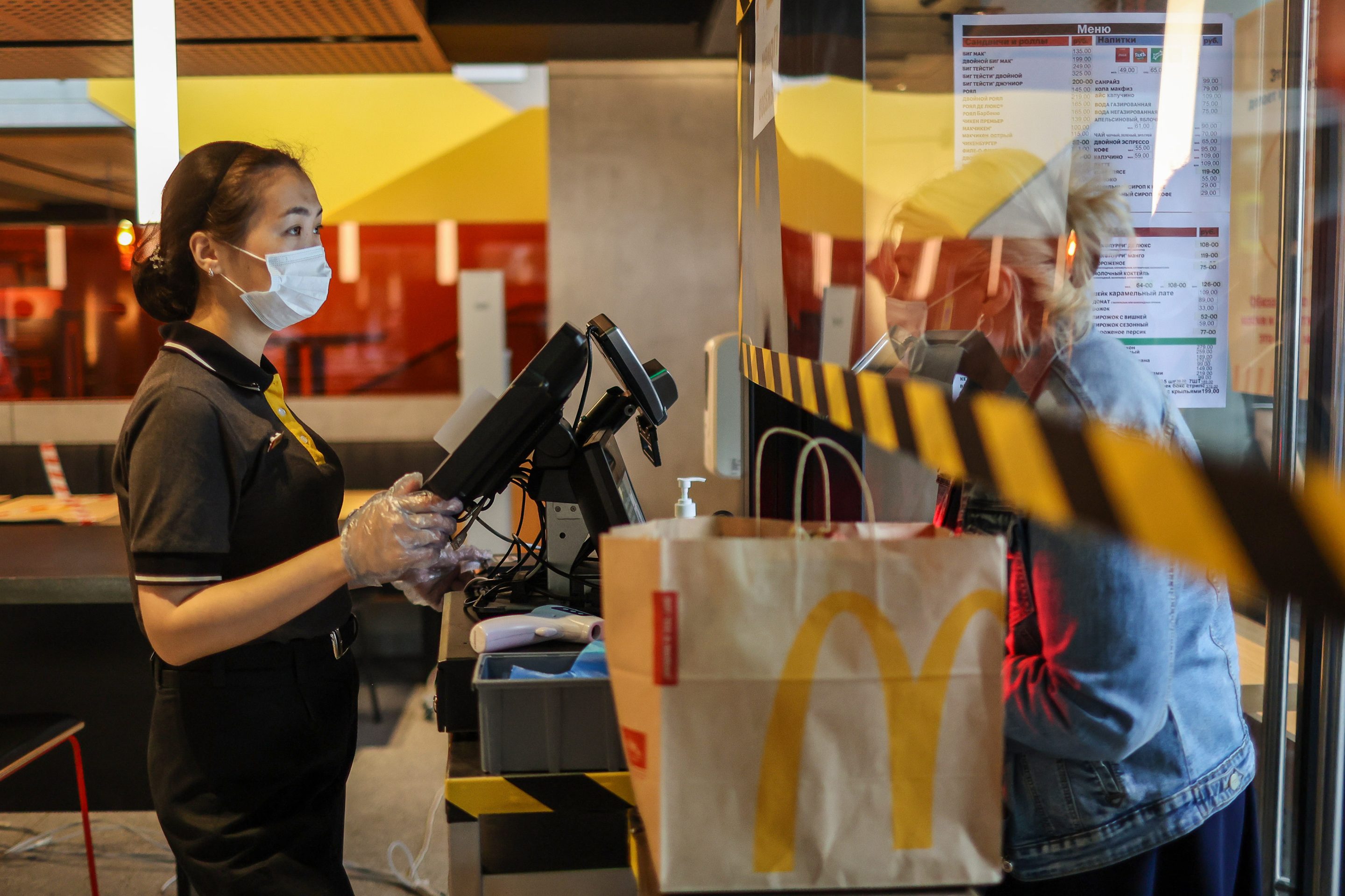 A customer places a takeaway food order inside a McDonalds Corp. restaurant in Moscow, Russia, on June 30, 2021.