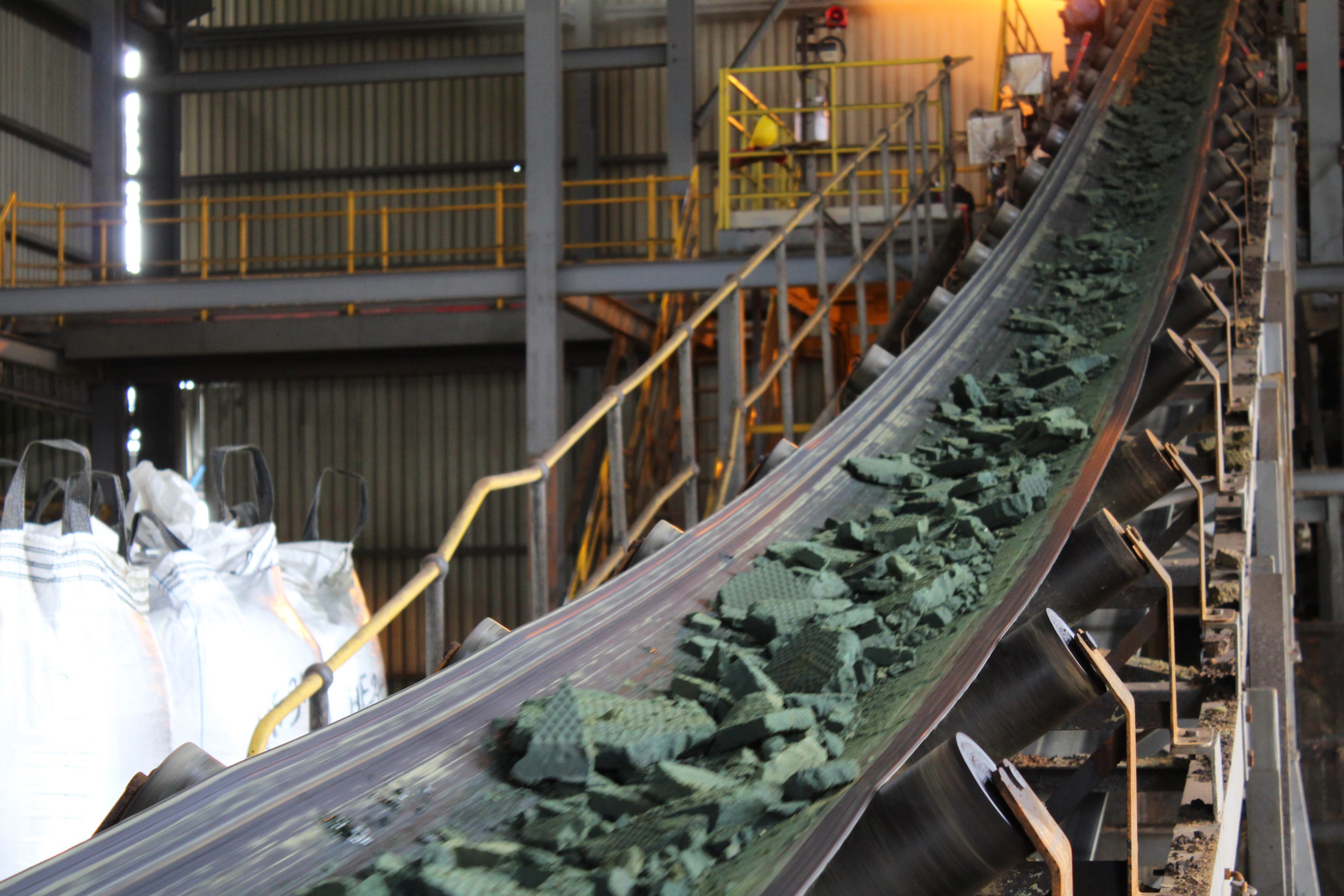 A conveyor belt moves raw cobalt for processing at the Etoile mine, operated by Chemaf Sarl, in Katanga province near Lubumbashi, the Democratic Republic of Congo, on Wednesday, Dec. 22, 2021.