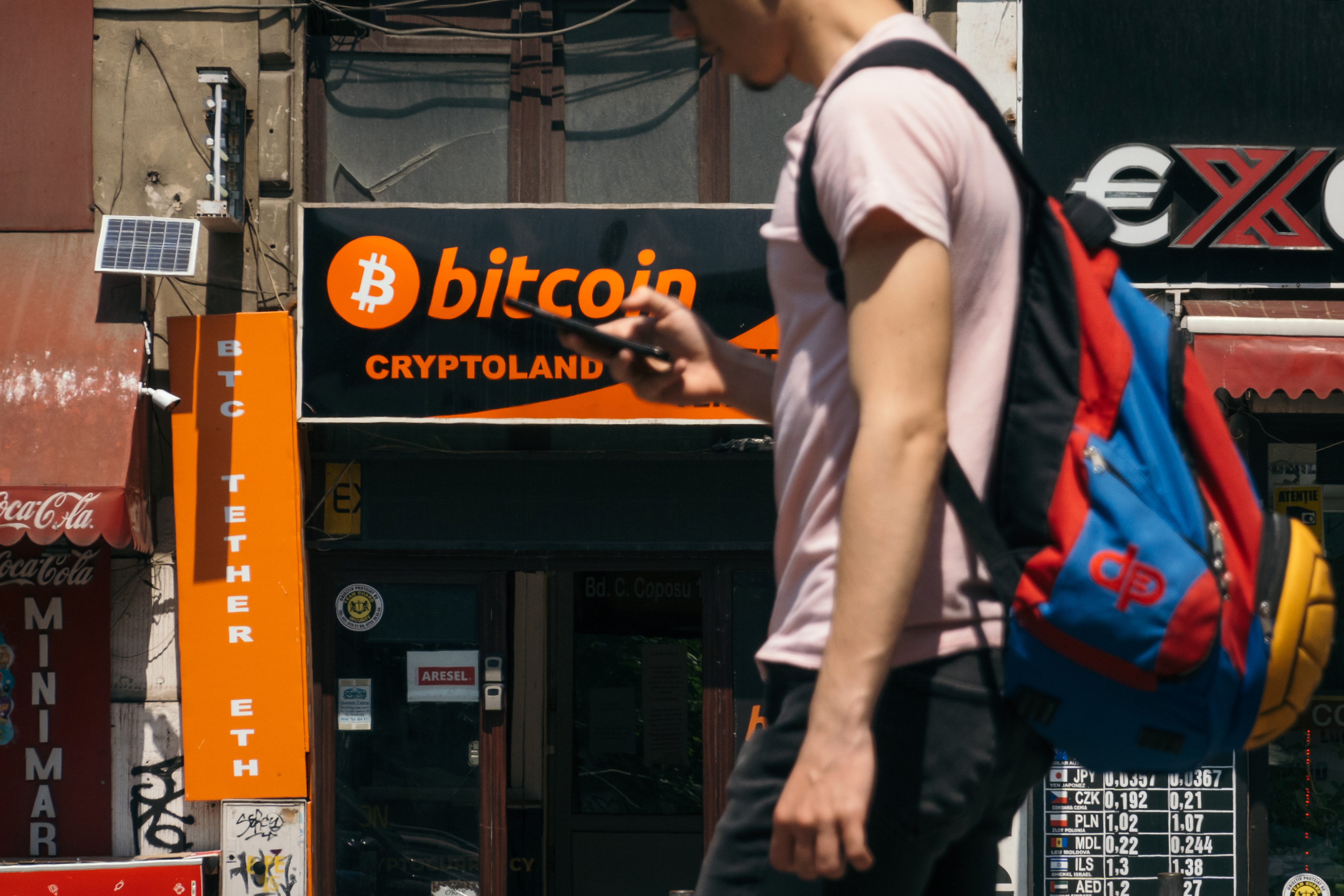 A cryptocurrency automated teller machine (ATM) kiosk next door to a currency exchange office in Bucharest, Romania, on May 31.