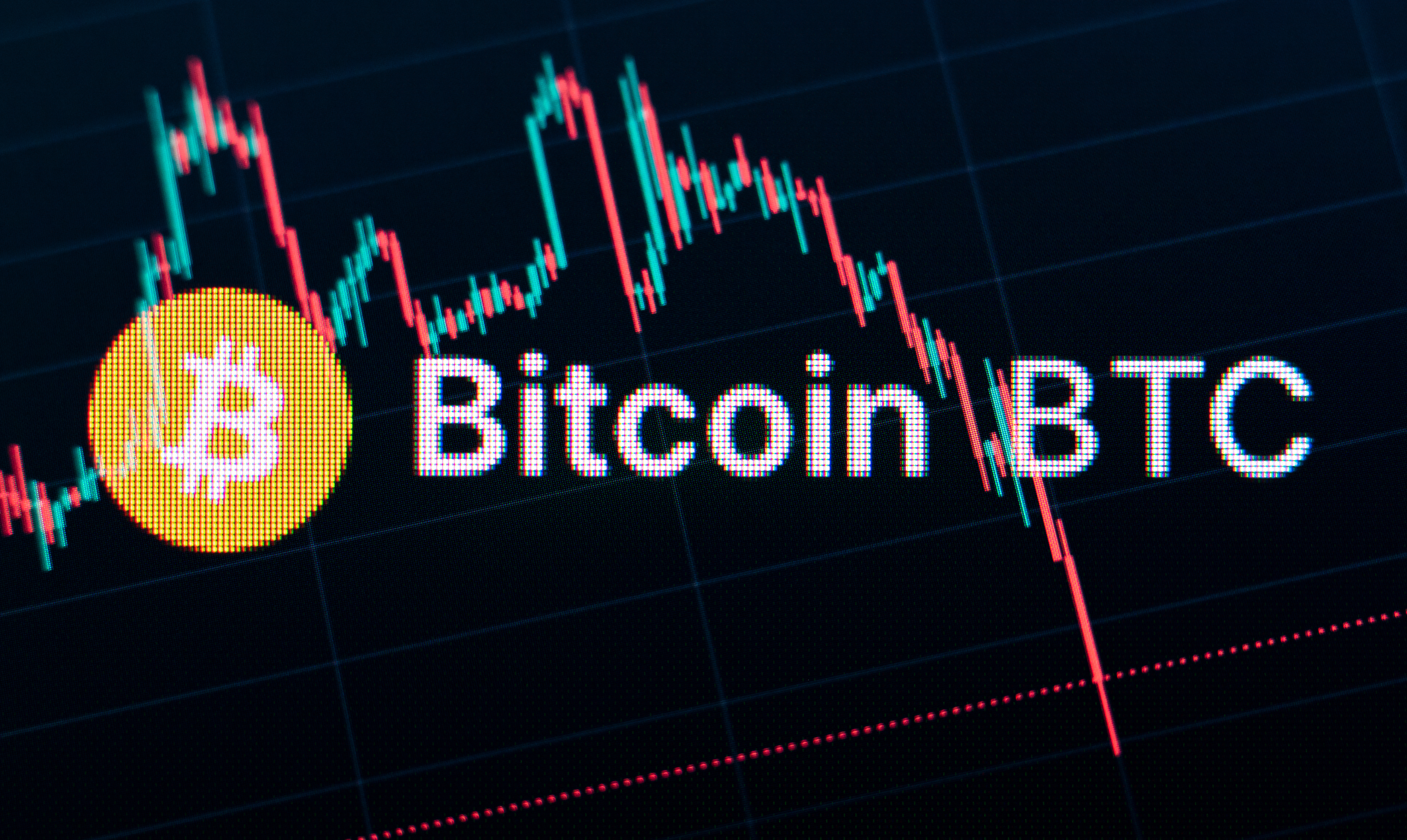 The logo of the cryptocurrency Bitcoin is seen on Trading View on the monitor of a computer in an office.