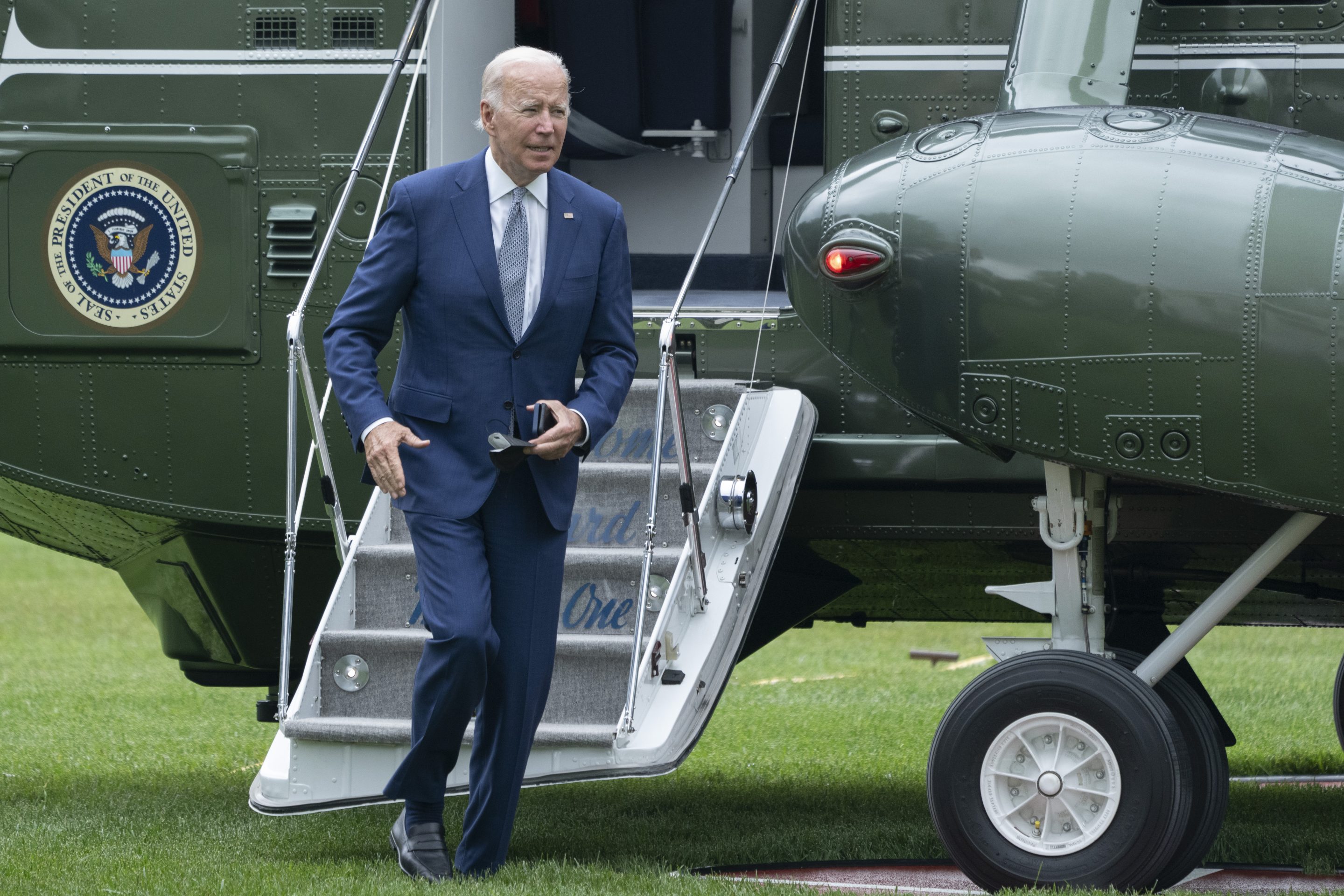 U.S. President Joe Biden disembarks from Marine One on June 14.