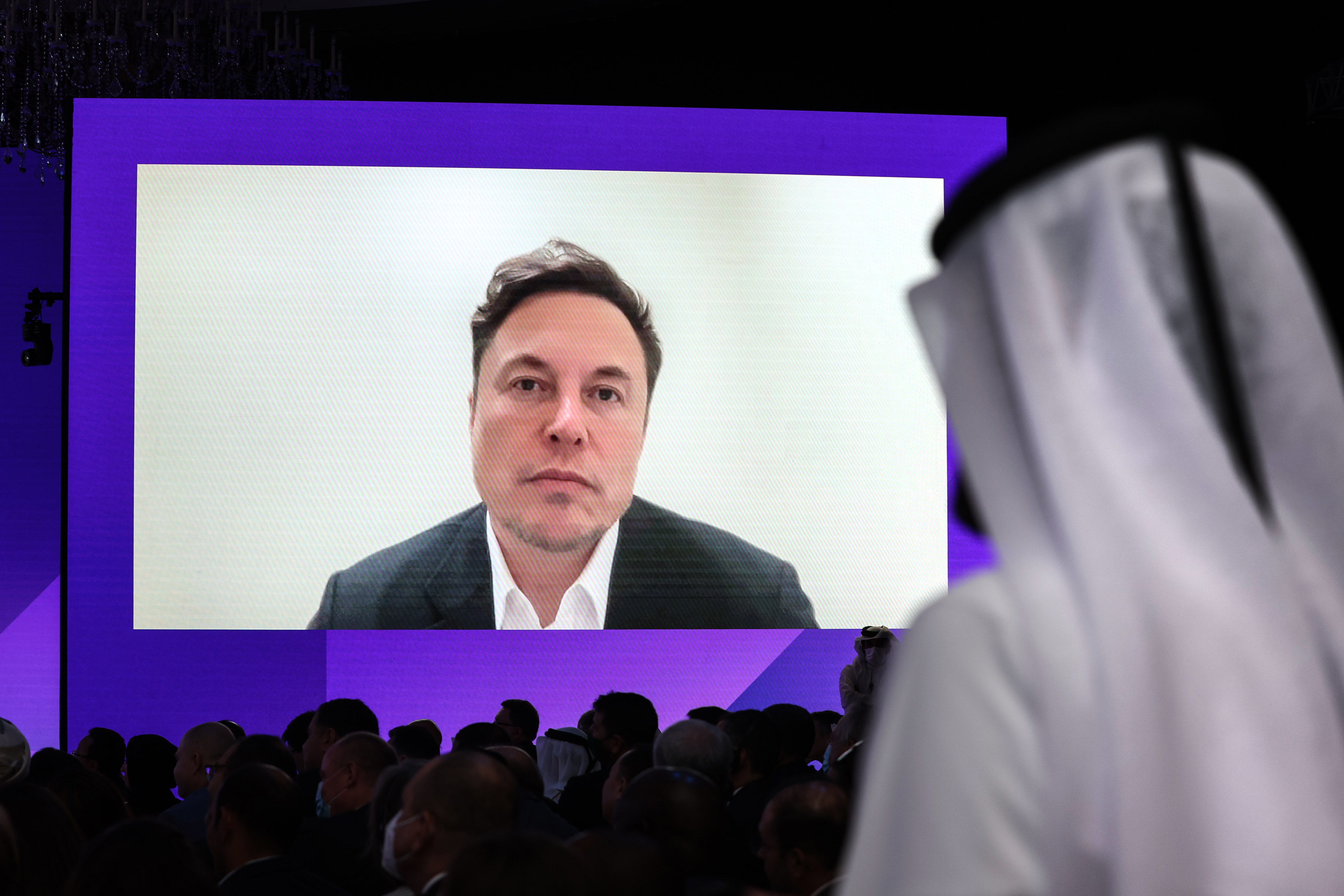 Tesla CEO Elon Musk appears via video link during the Qatar Economic Forum in Doha, Qatar, on June 21, 2022.