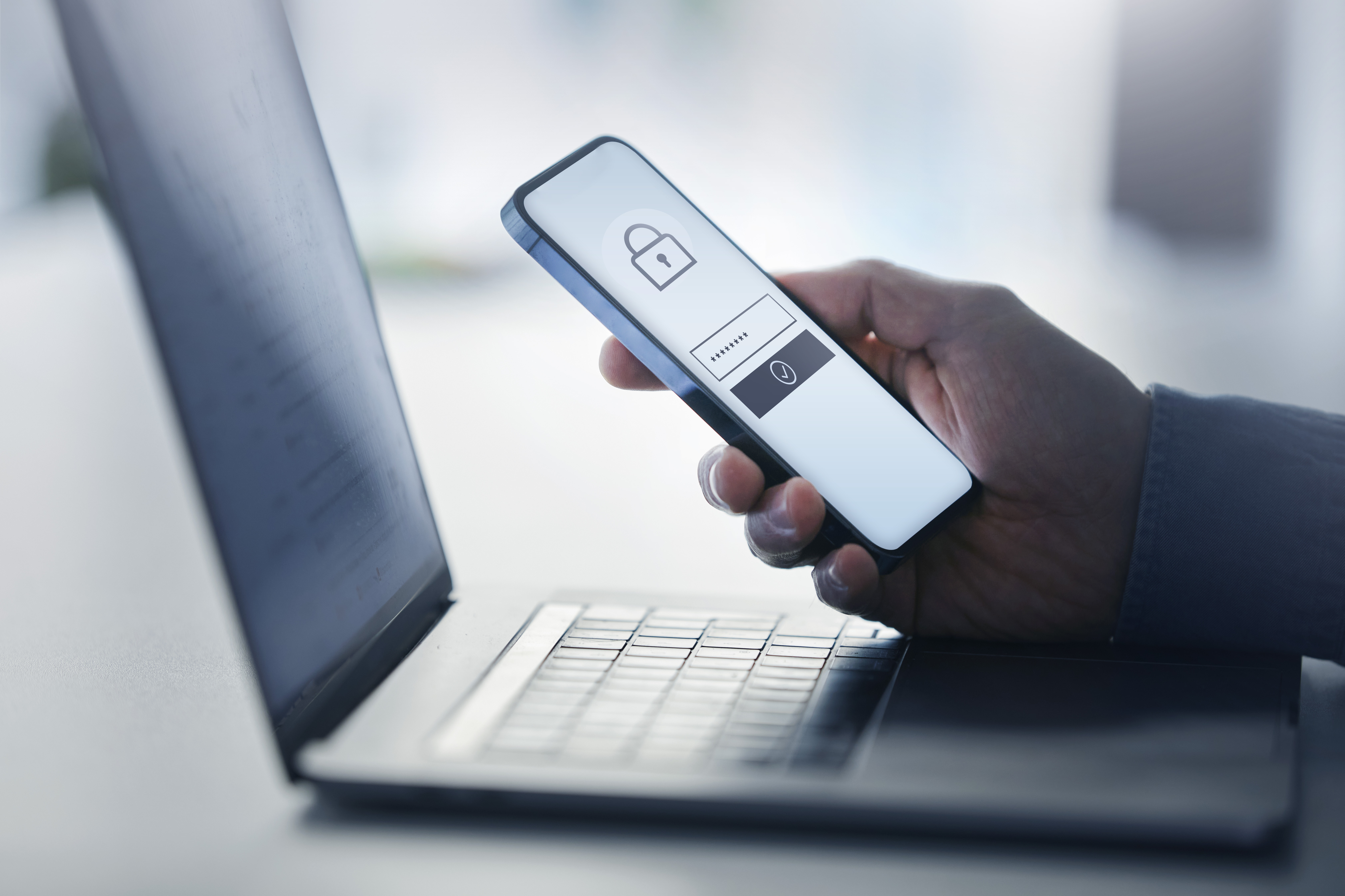 A person attempts to unlock their password-protected phone.