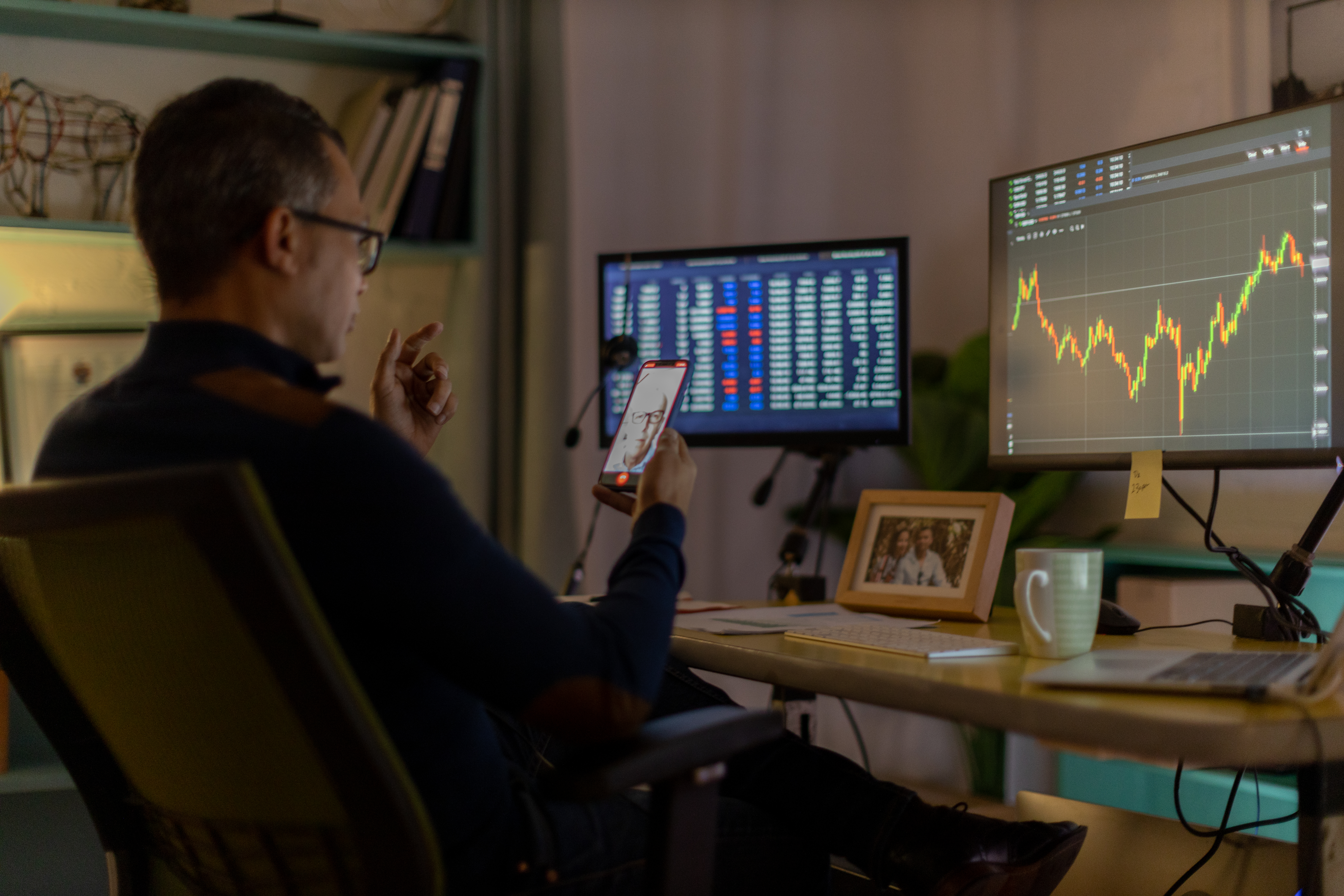 trader looks at screen