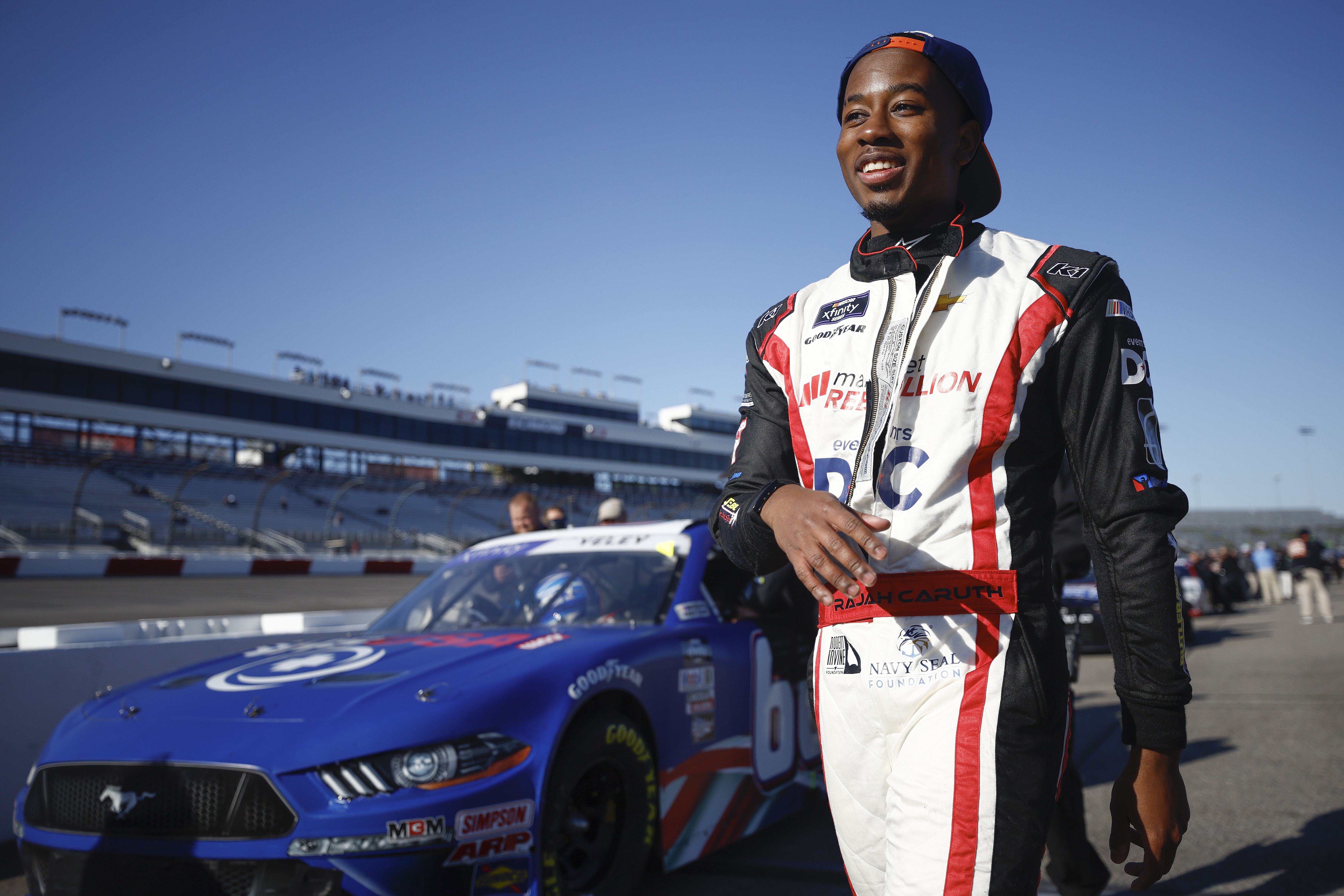 Rajah Caruth, driver of the #44 Virginia State Chevrolet, walks the grid during qualifying for the NASCAR Xfinity Series ToyotaCare 250 at Richmond Raceway on April 02, 2022 in Richmond, Virginia.
