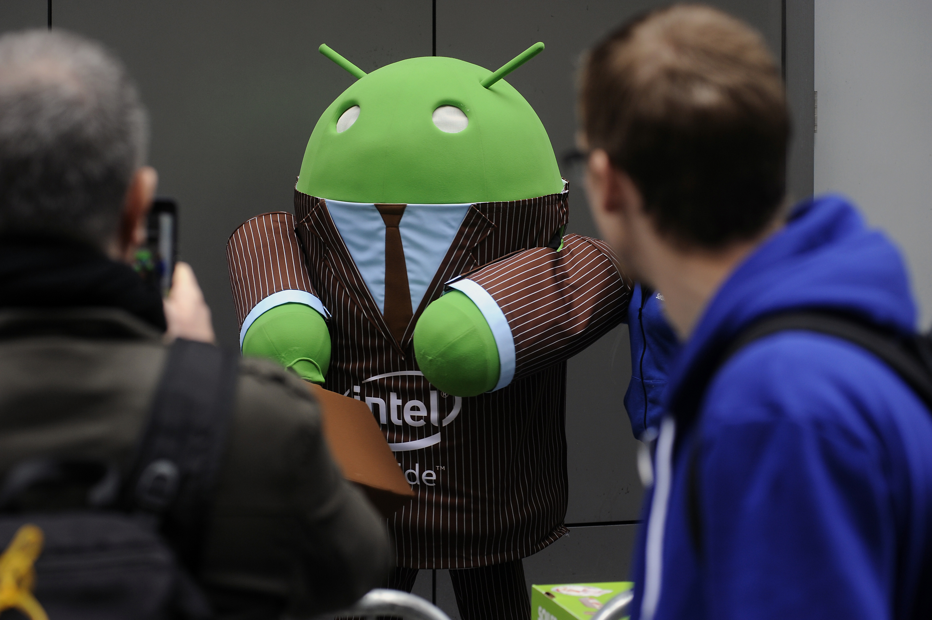 Google's green Android mascot wears a suit