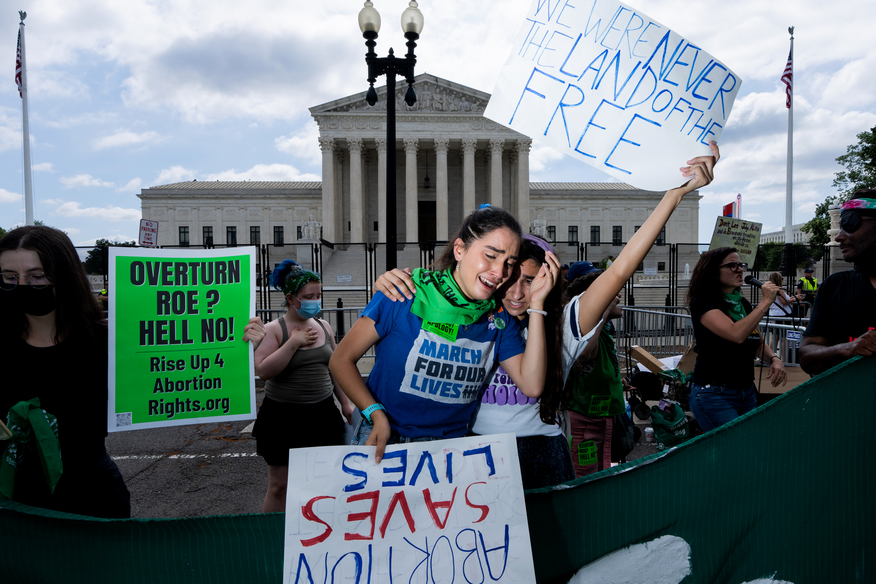 Pro-choice demonstrators react to the Supreme Court's decision on Friday.